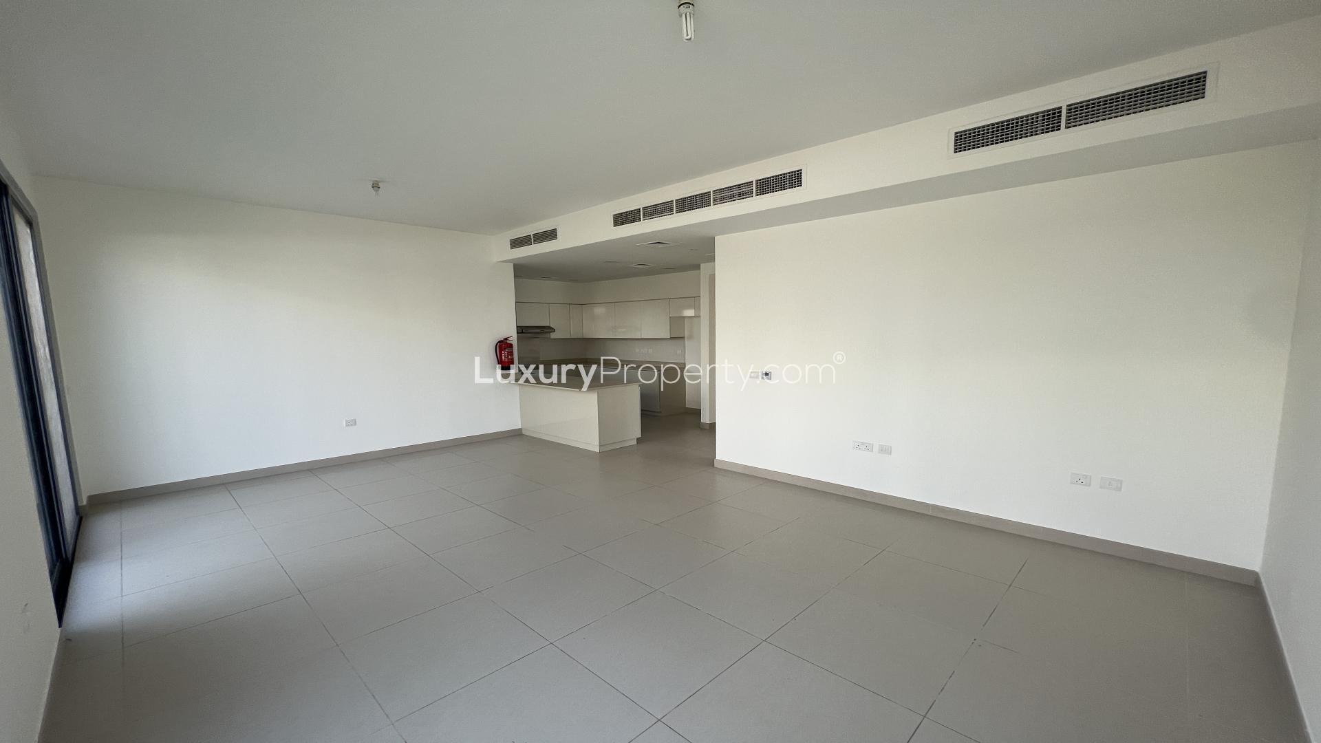 "Spacious interior of 4-bedroom villa in Maple 2, Dubai Hills Estate, available for rent.",Open-plan living area in 4-bedroom villa, Maple 2, Dubai Hills Estate, available for rent