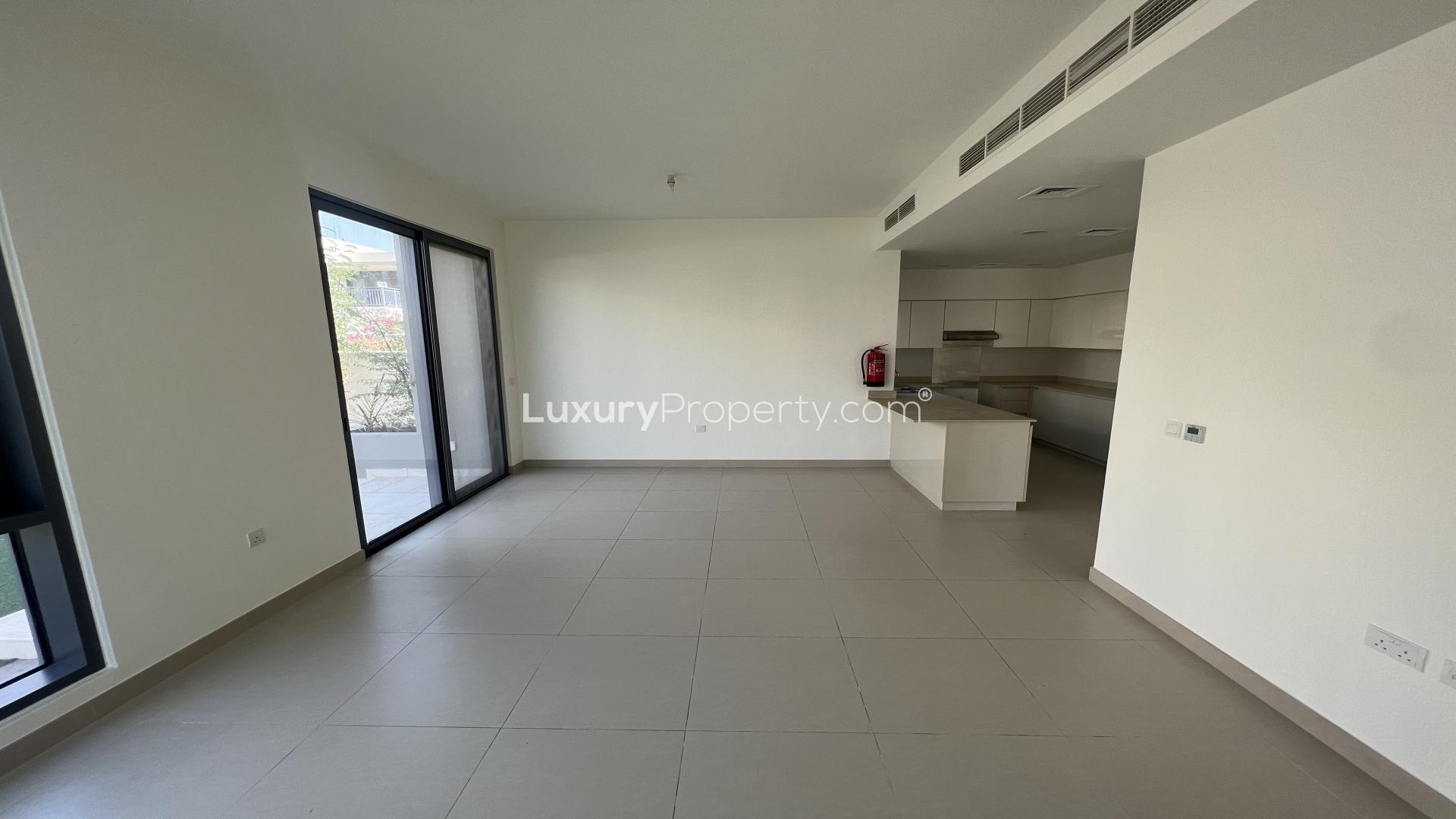 Empty living area with large windows in Maple 2 villa, Dubai Hills Estate