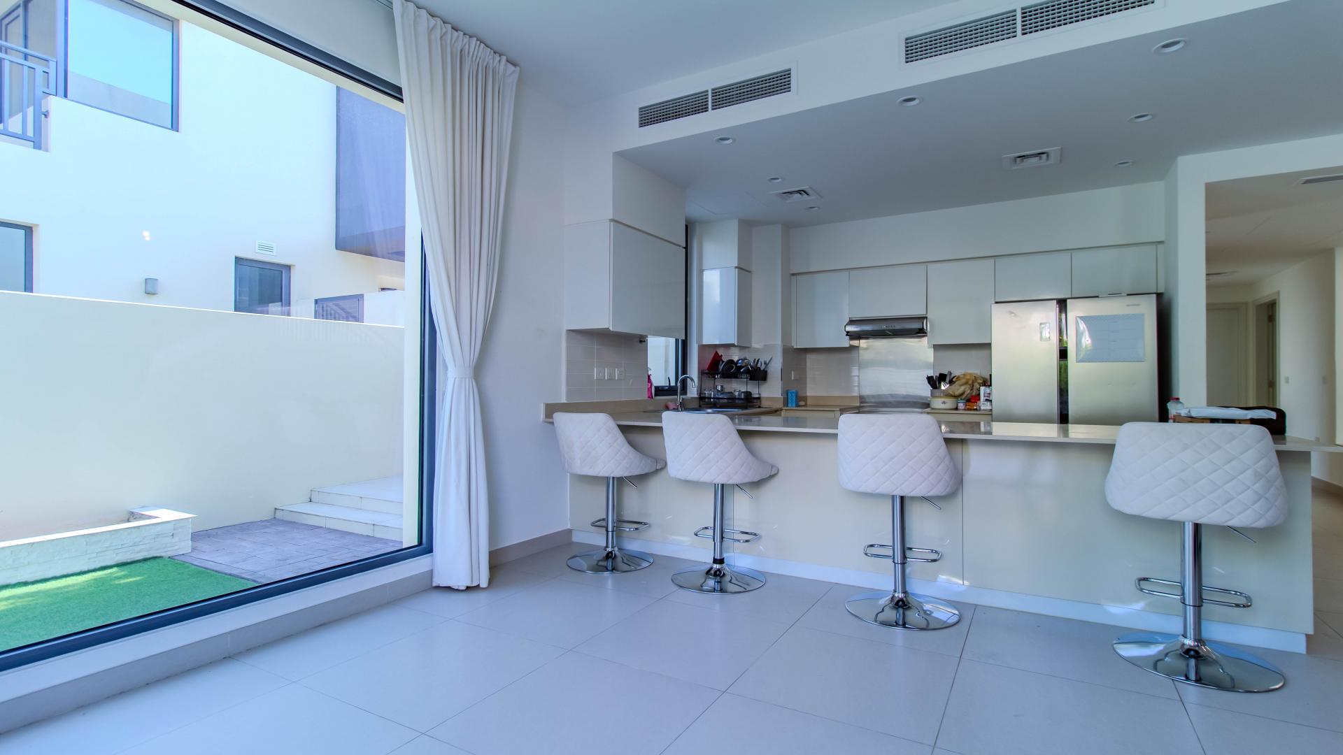 Modern villa exterior with two-car garage in Maple at Dubai Hills Estate, available for rent