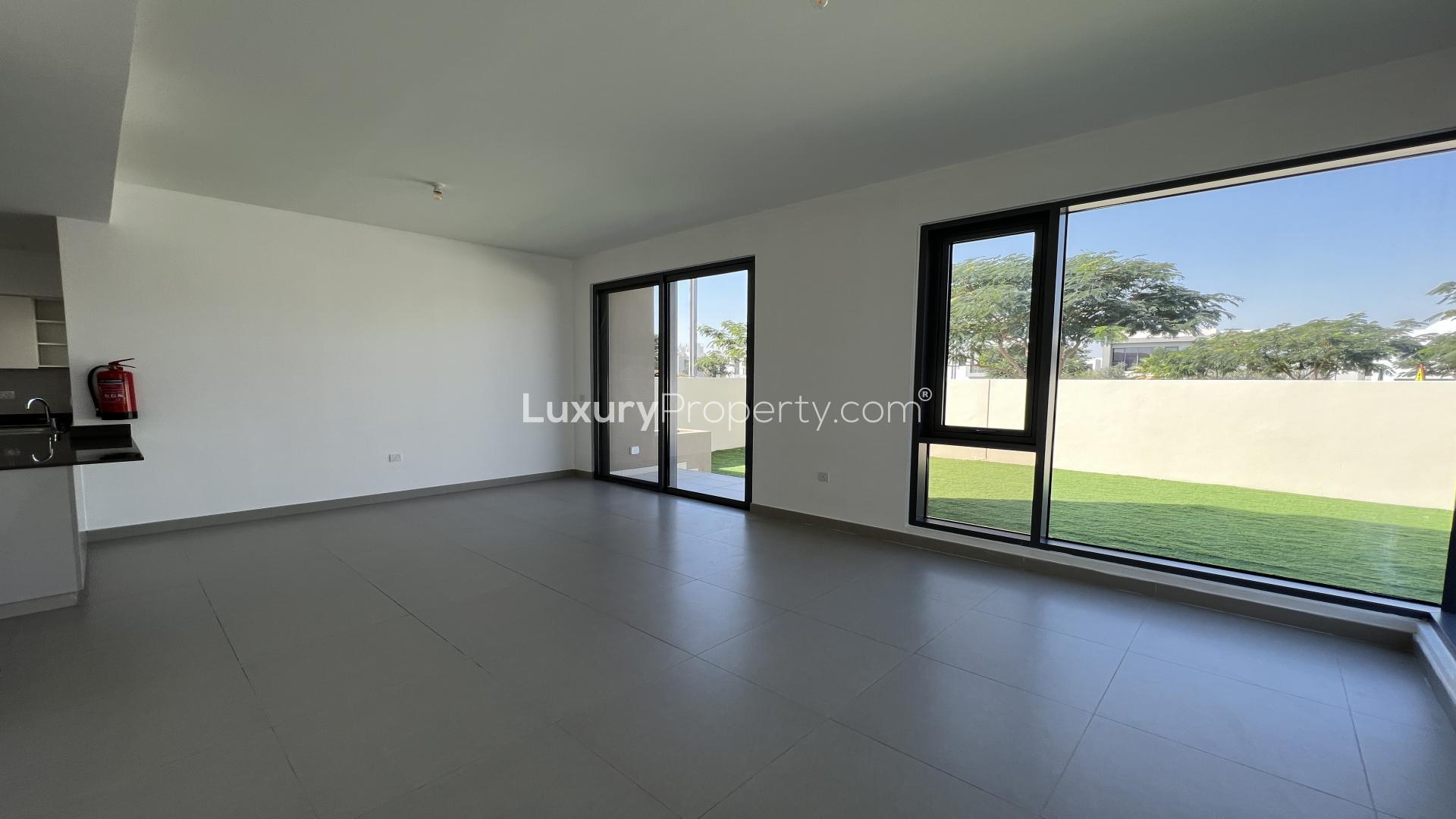 Luxurious 4-bedroom villa exterior in Maple, Dubai Hills Estate with garden view