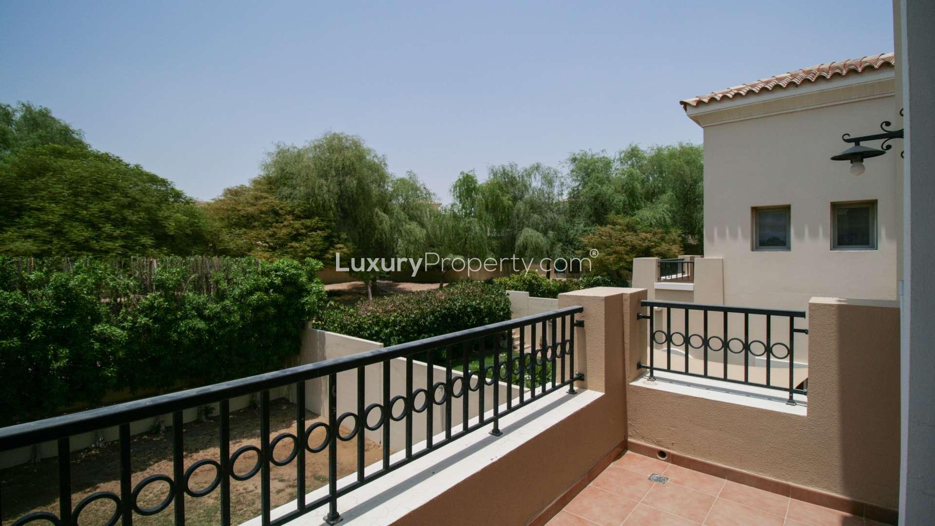 Bright living room in 3-bedroom villa, Alma, Arabian Ranches, with large windows and tiled floor