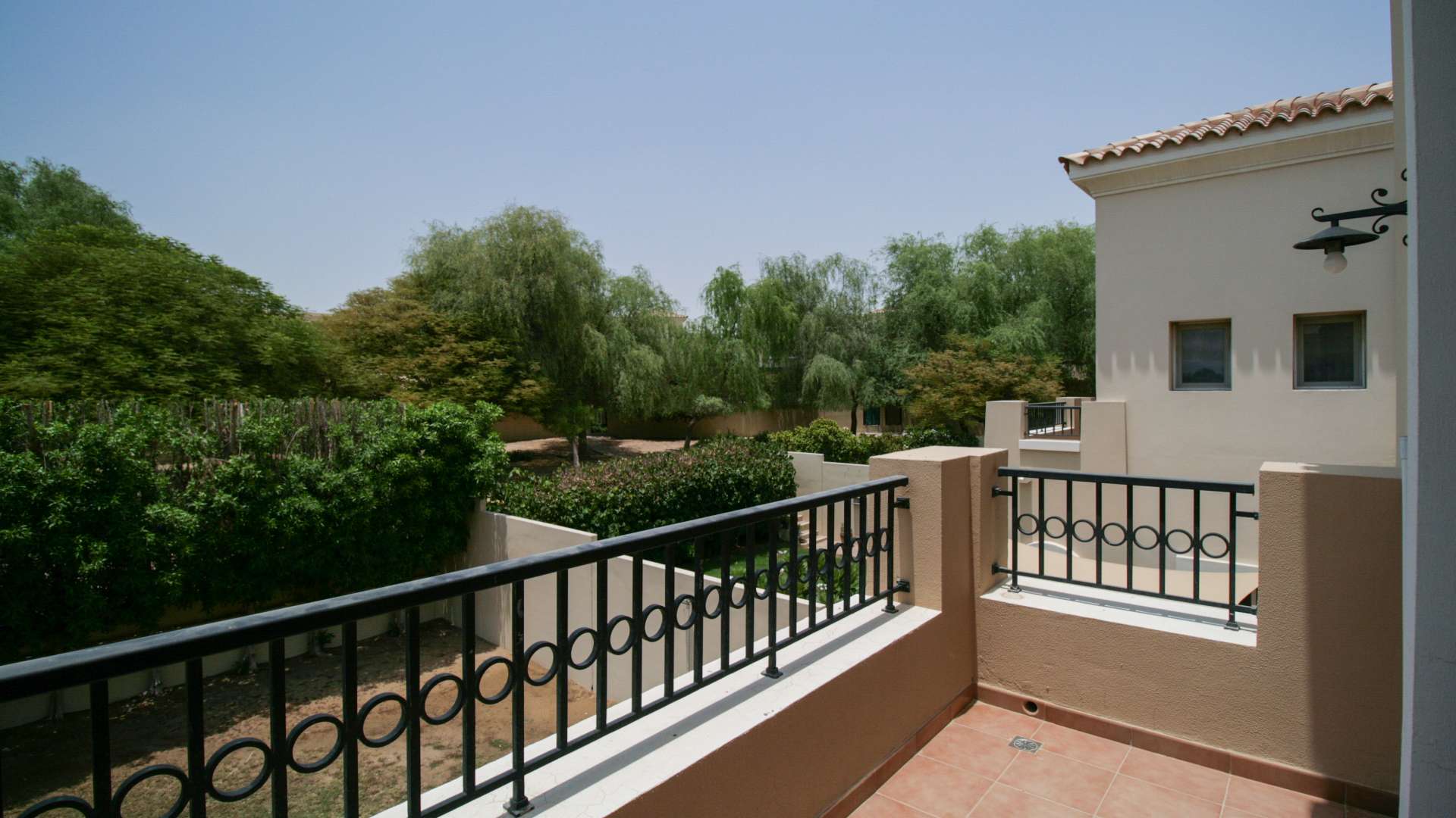 Bright living room in 3-bedroom villa, Alma, Arabian Ranches, with large windows and tiled floor