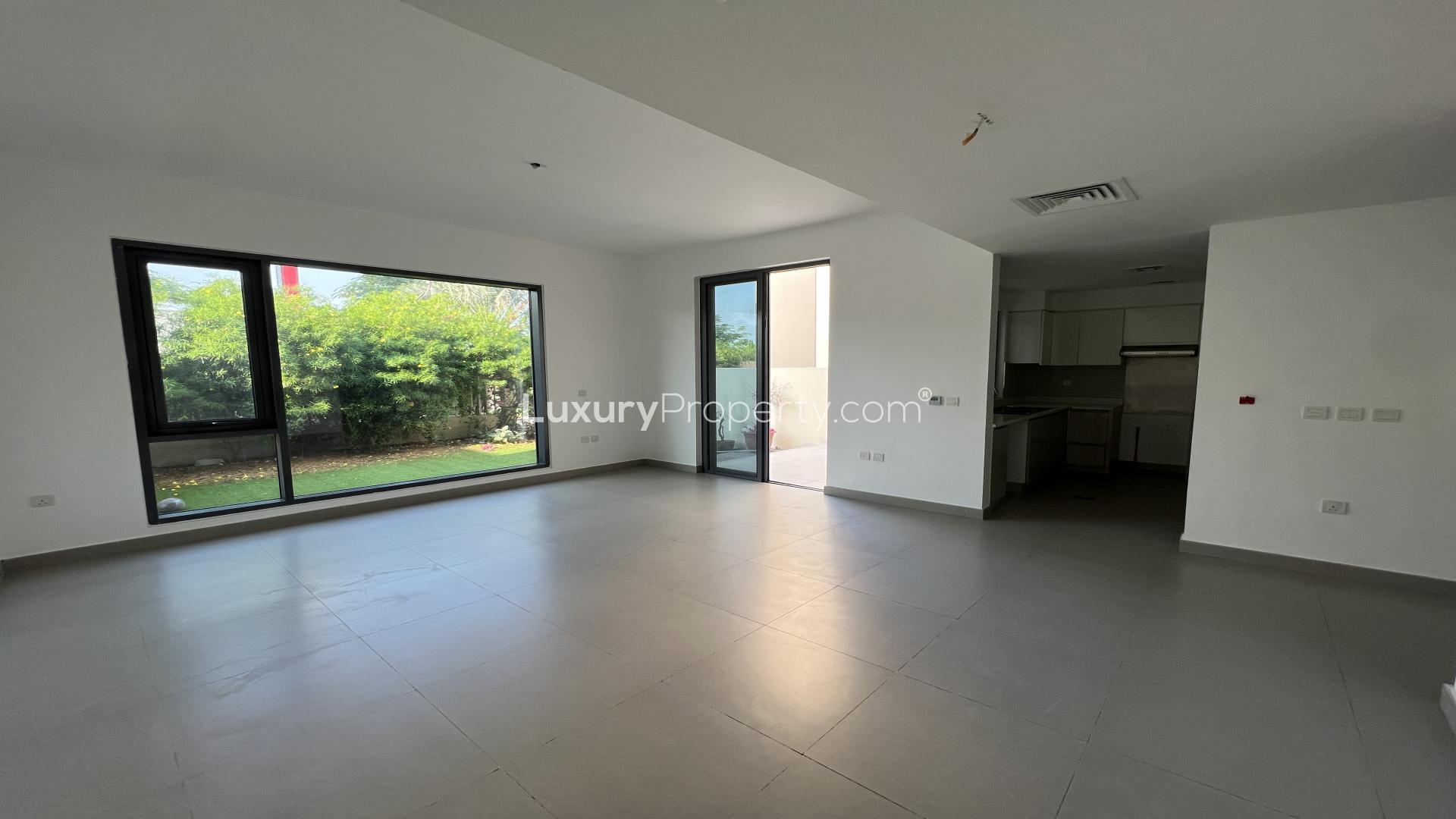 Luxurious 3-bedroom townhouse exterior in Maple, Dubai Hills Estate with garden view