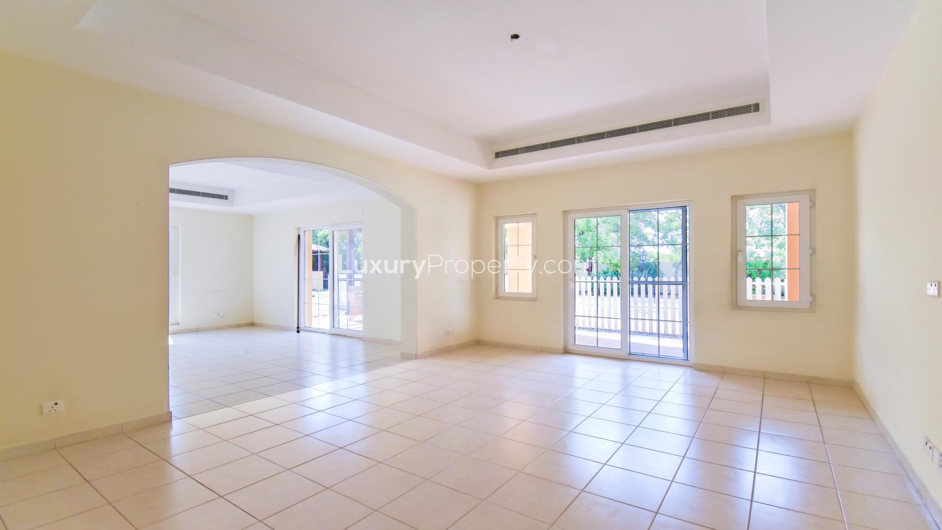 "Spacious villa with private pool in Mirador La Coleccion, Arabian Ranches for rent.",Spacious living room with large windows in Arabian Ranches villa for rent