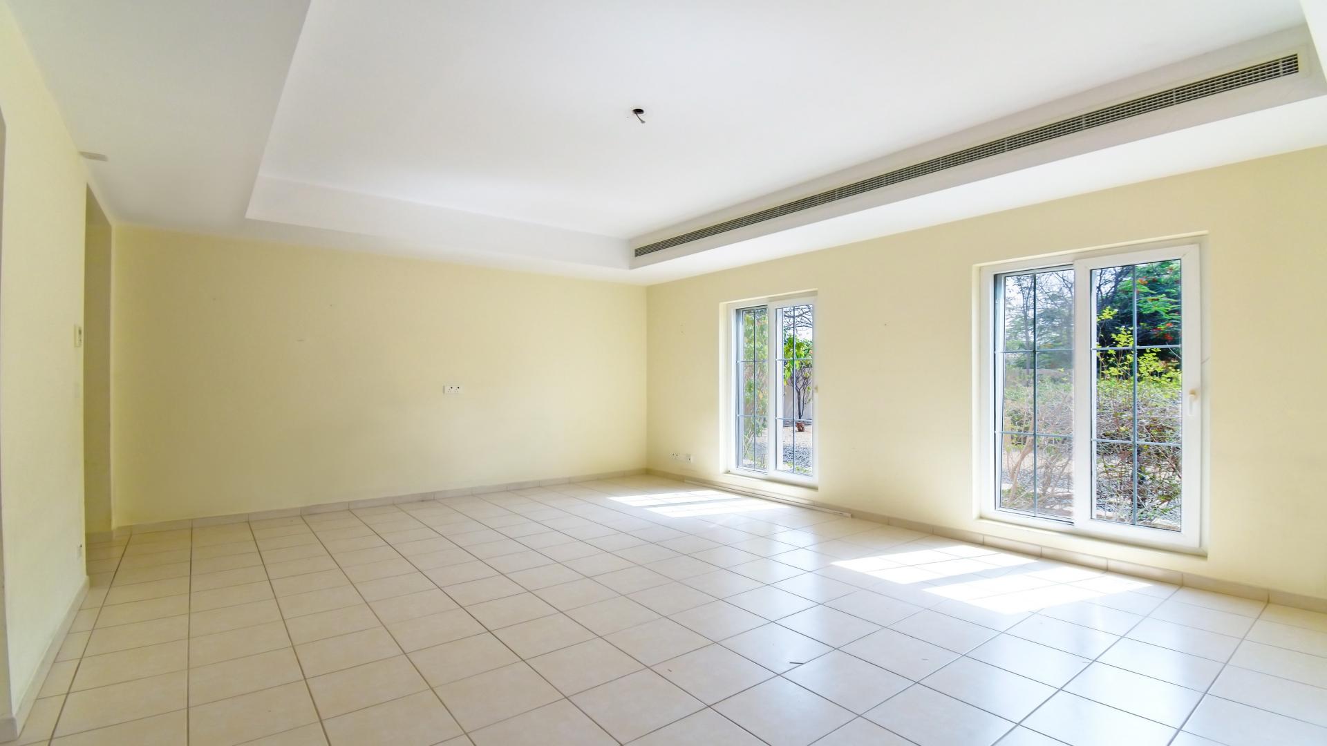 Spacious living room with large windows in Mirador La Coleccion, Arabian Ranches villa for rent