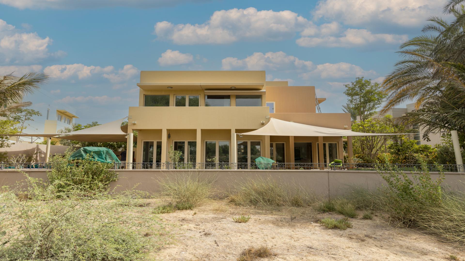 Outdoor patio with pool at 5-bedroom villa in Savannah, Arabian Ranches for rent