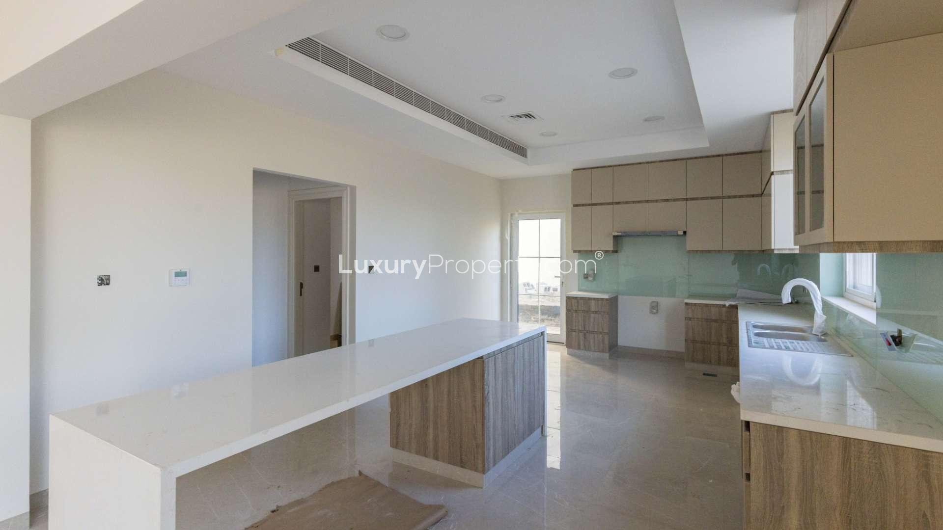 Modern kitchen in four-bed villa, Jumeirah Golf Estates, Fire community, marble countertops