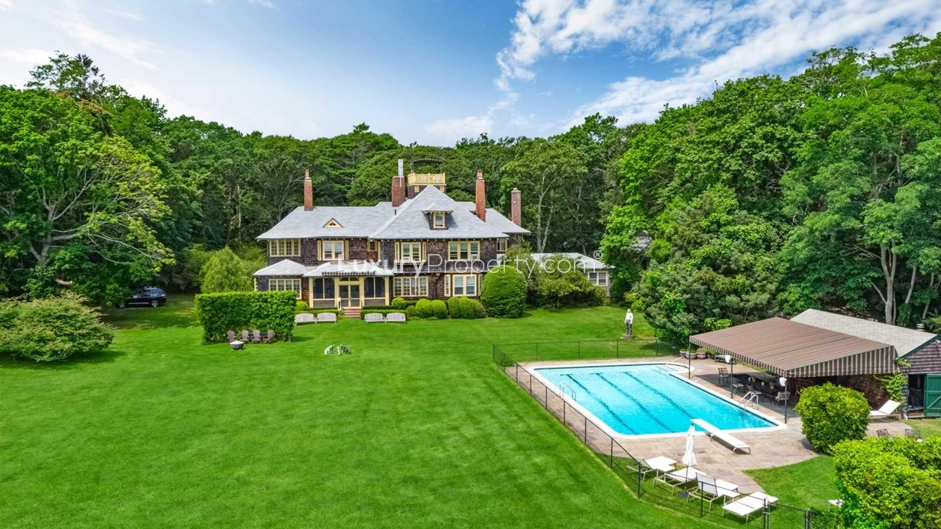 Spacious modern art gallery in luxurious Southampton villa, featuring contemporary installations and high ceilings