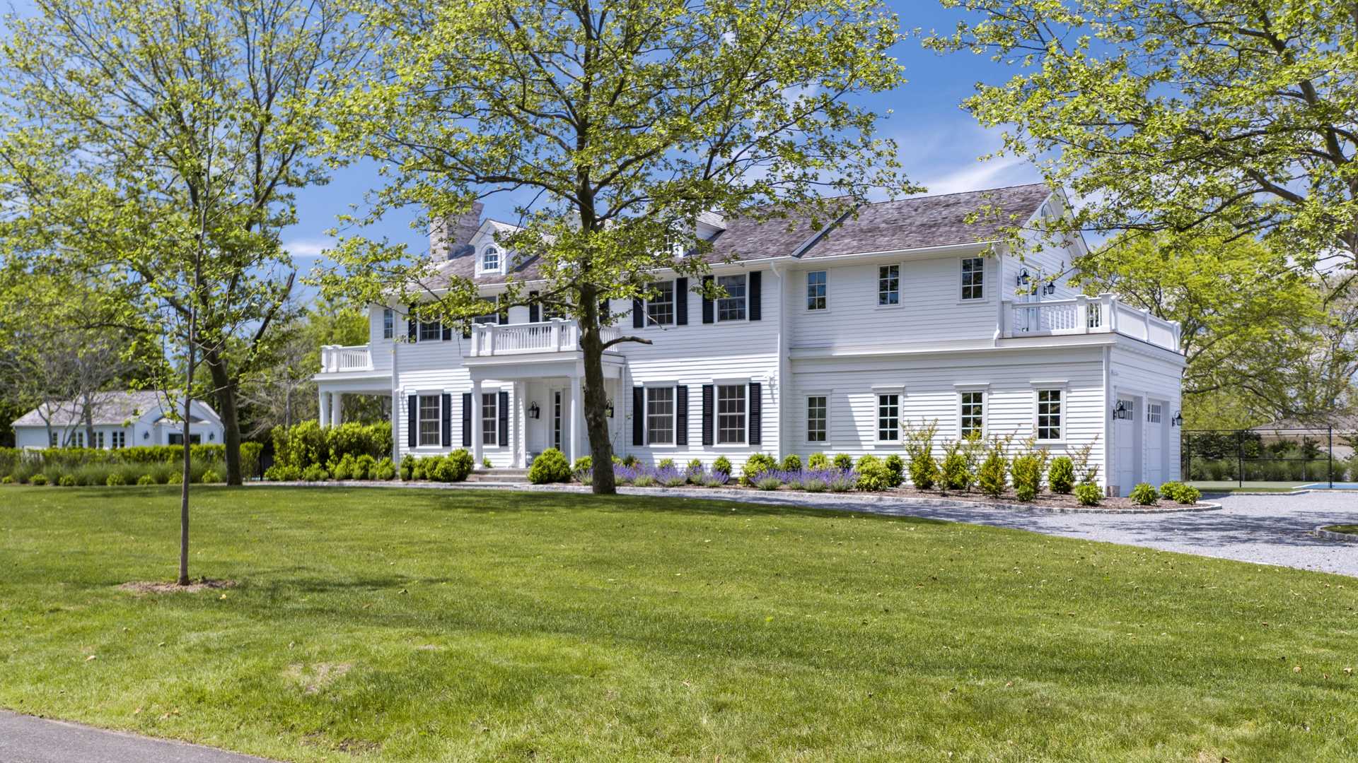 Luxurious Hamptons villa with pool, tennis court, and elegant backyard at 7 Bayfield Lane