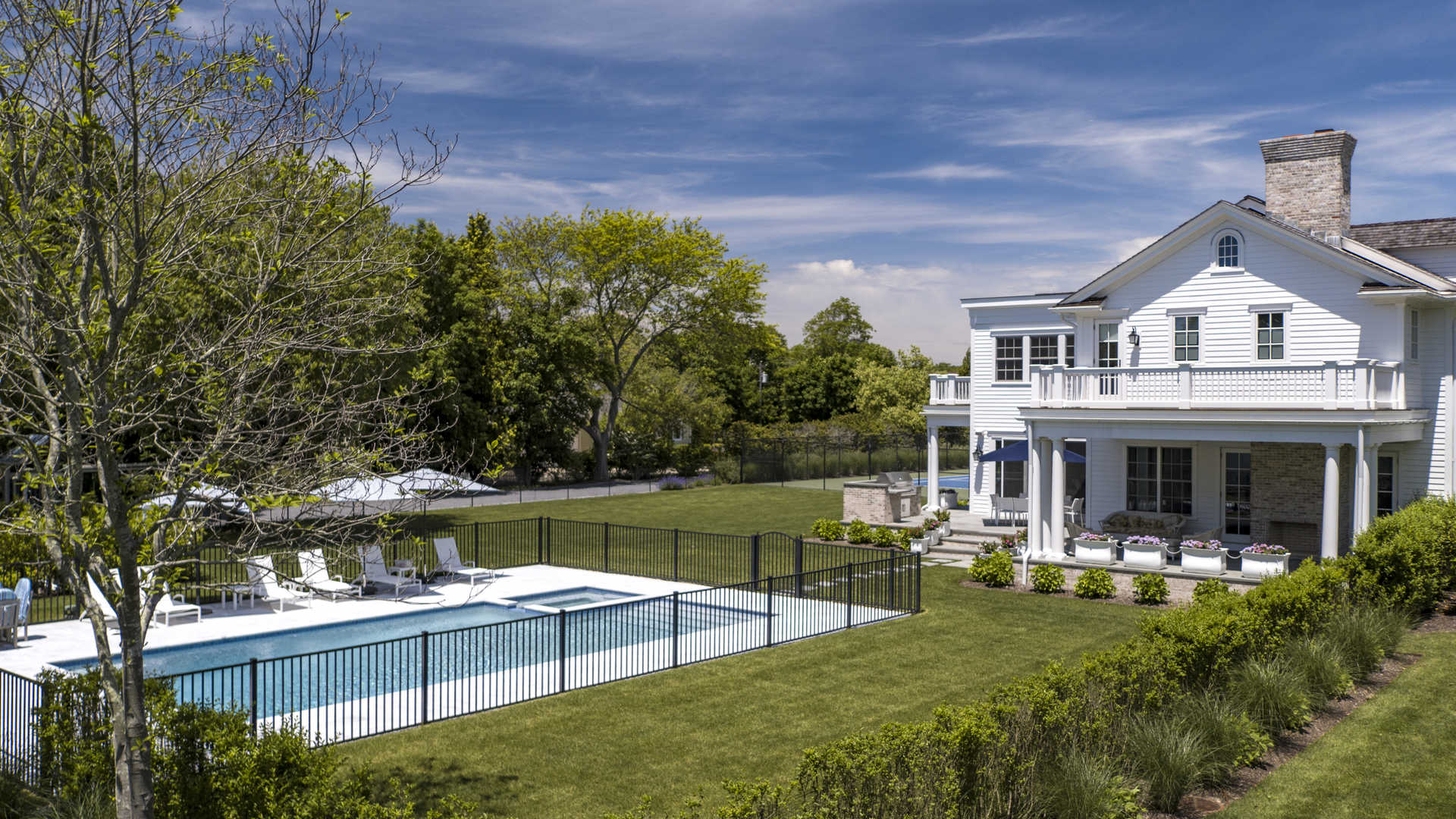 Twelve-bedroom villa with traditional design in Westhampton, Hamptons, New York, surrounded by trees