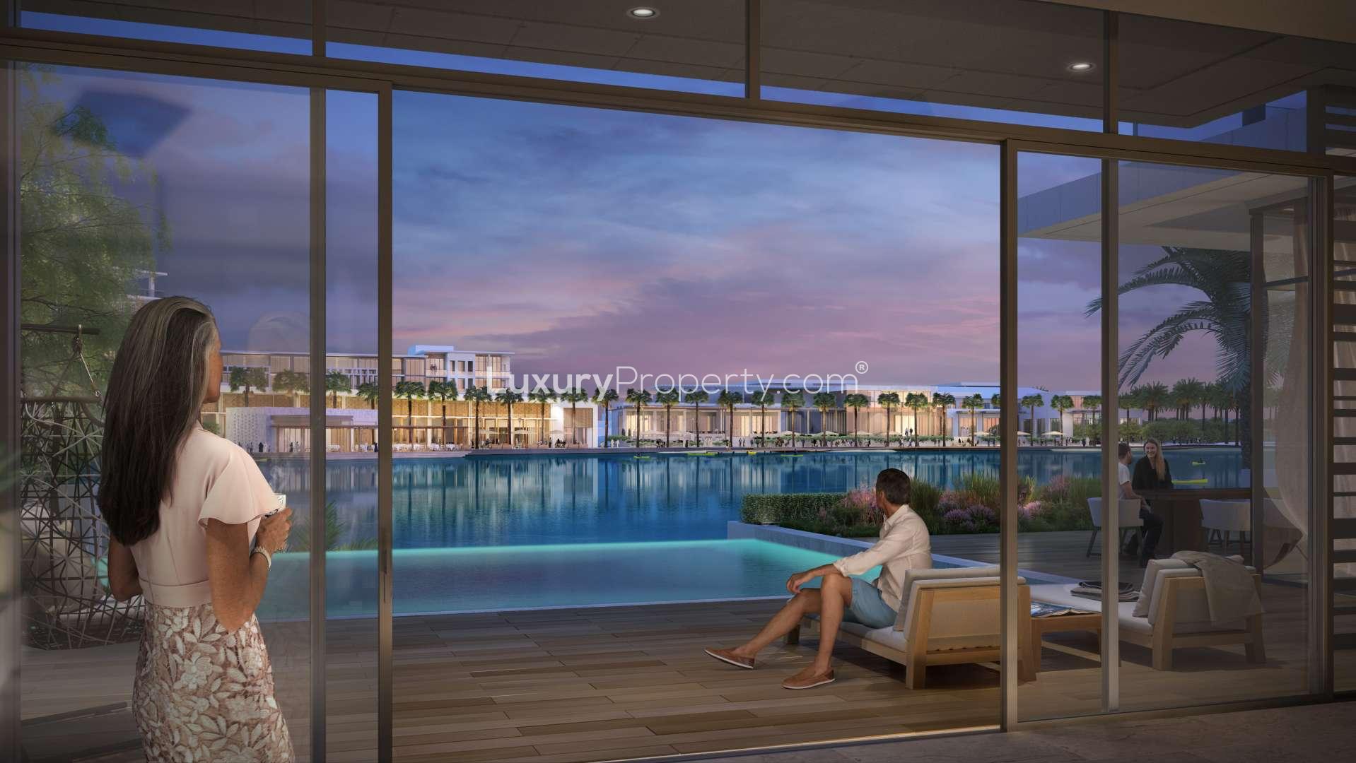 Contemporary four-bedroom villa exterior at Aura, Tilal Al Ghaf, with landscaped garden and driveway