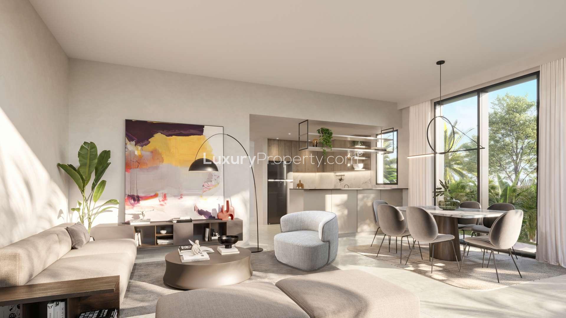 Modern living room in 4-bedroom townhouse, Aura Gardens, Tilal Al Ghaf, with natural light