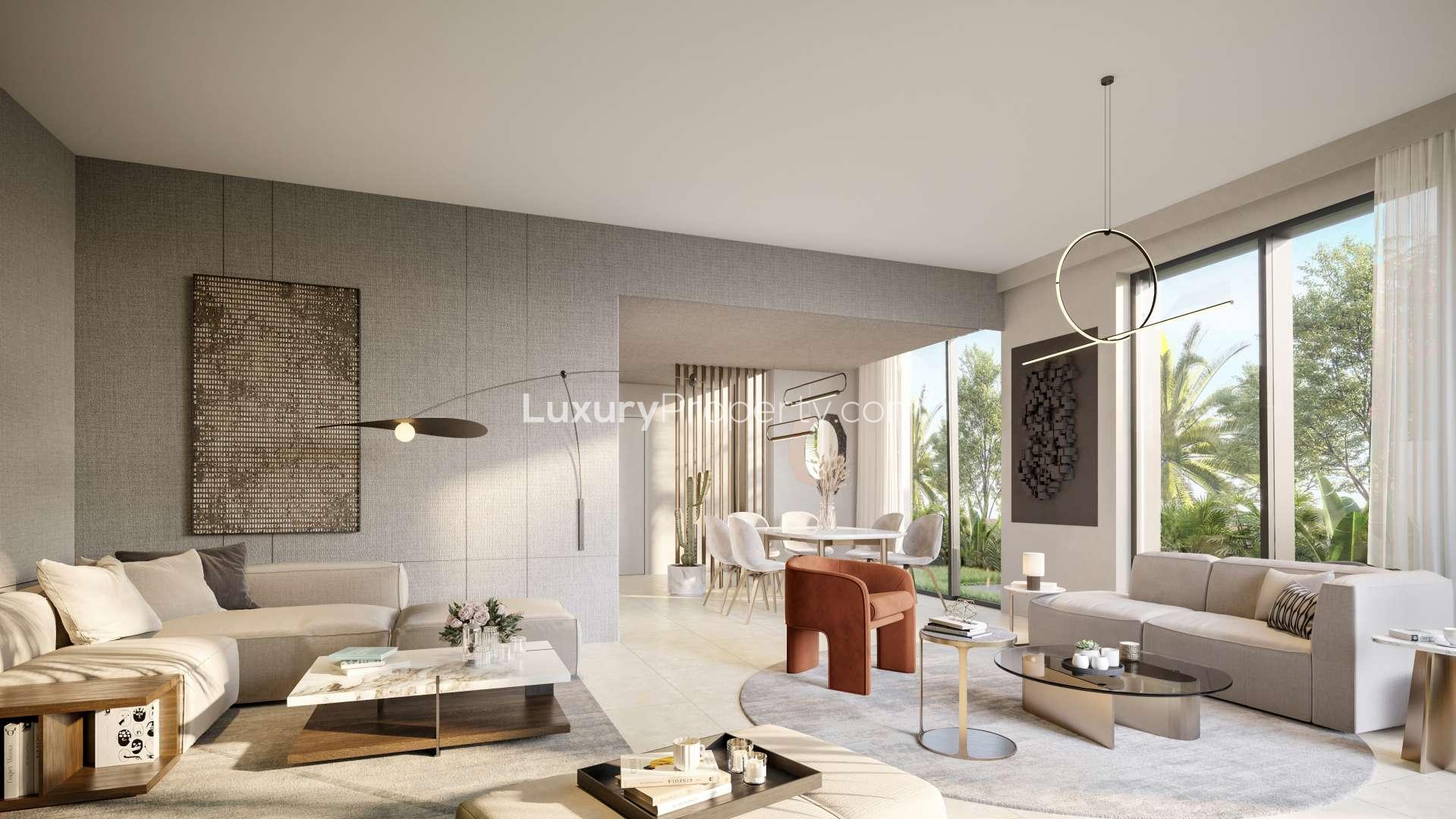 4-bedroom townhouse in Aura Gardens, Tilal Al Ghaf with garage and lush landscaping