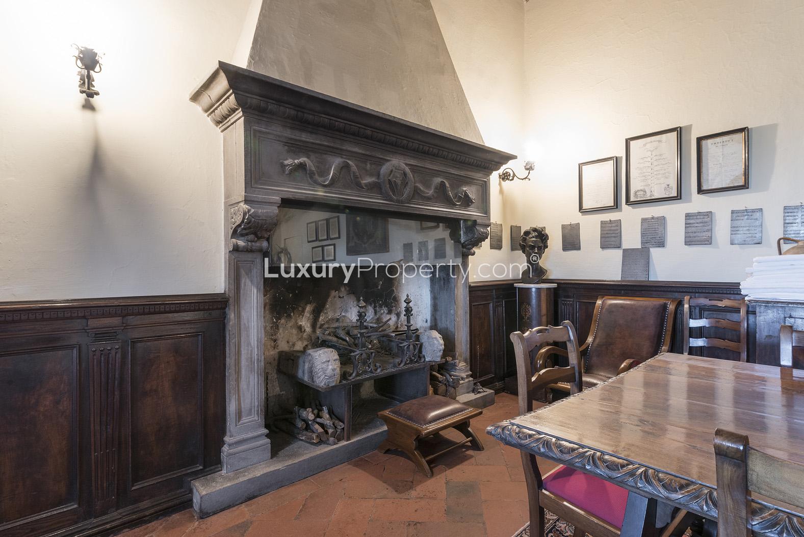 Historic kitchen in 15th-century Florence villa, featuring rustic decor and antique furnishings