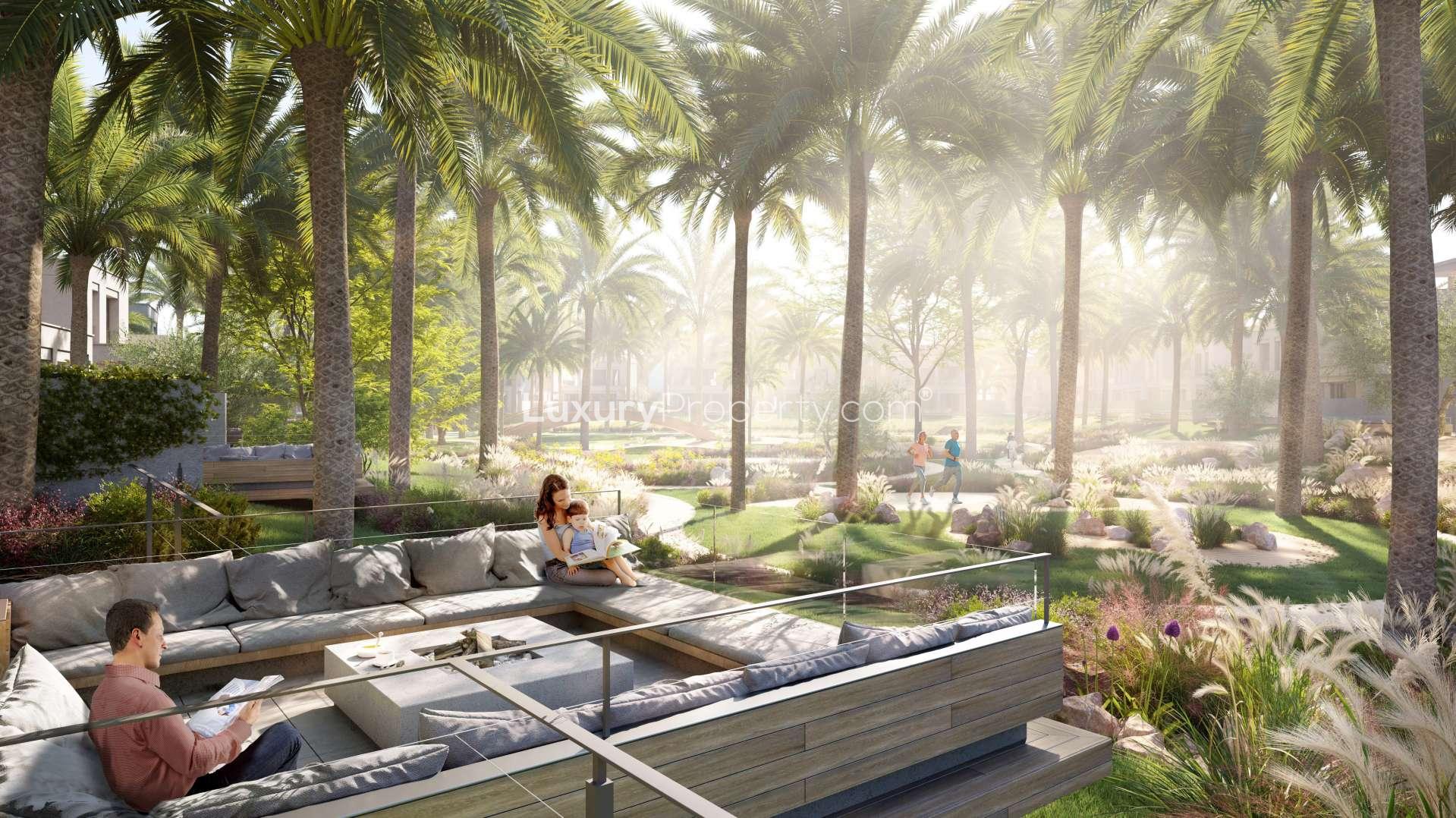 Luxurious villa terrace with dining area, overlooking lush gardens in Caya, Arabian Ranches III