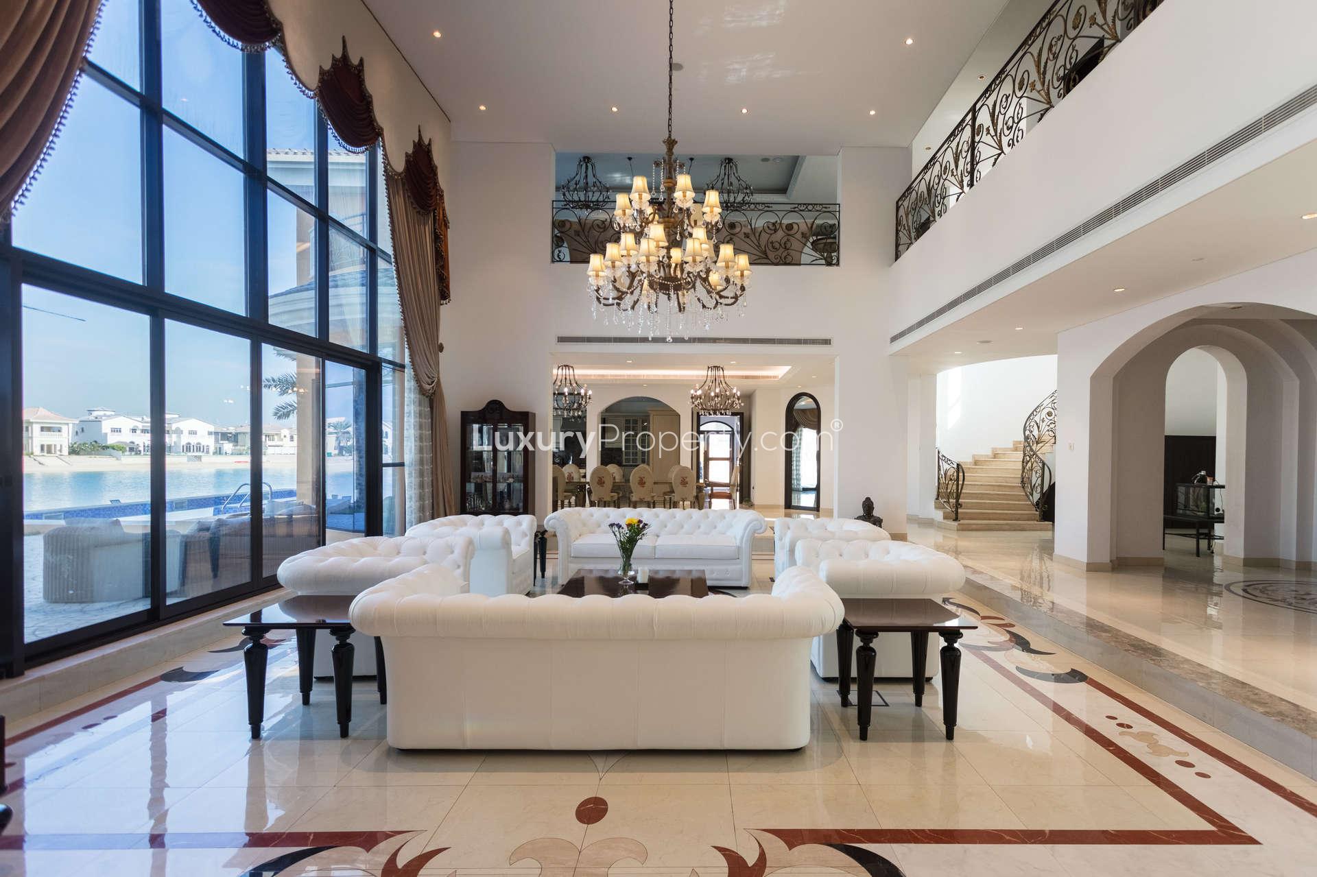 Luxurious villa living room with sea view, elegant decor, and grand chandelier, Palm Jumeirah