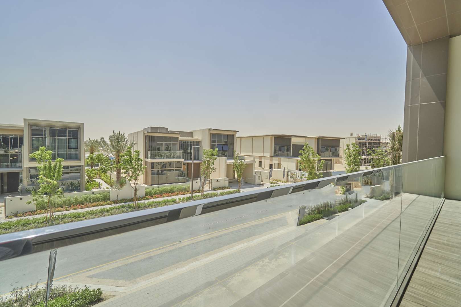 Modern villa exterior with lush lawn in Dubai Hills Estate, Golf Place community