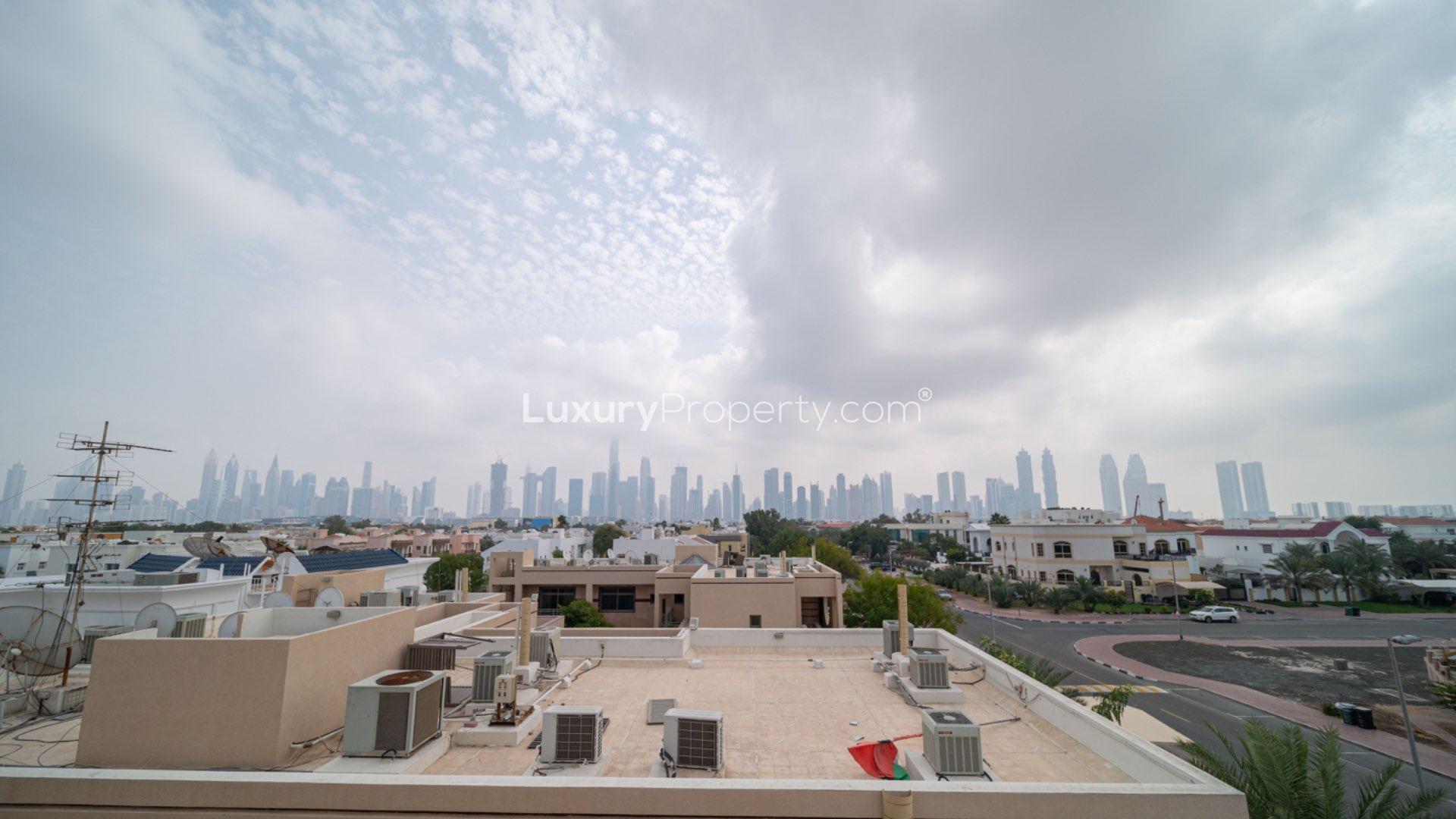 Spacious living area with floor-to-ceiling windows in Jumeirah 2 villa for sale