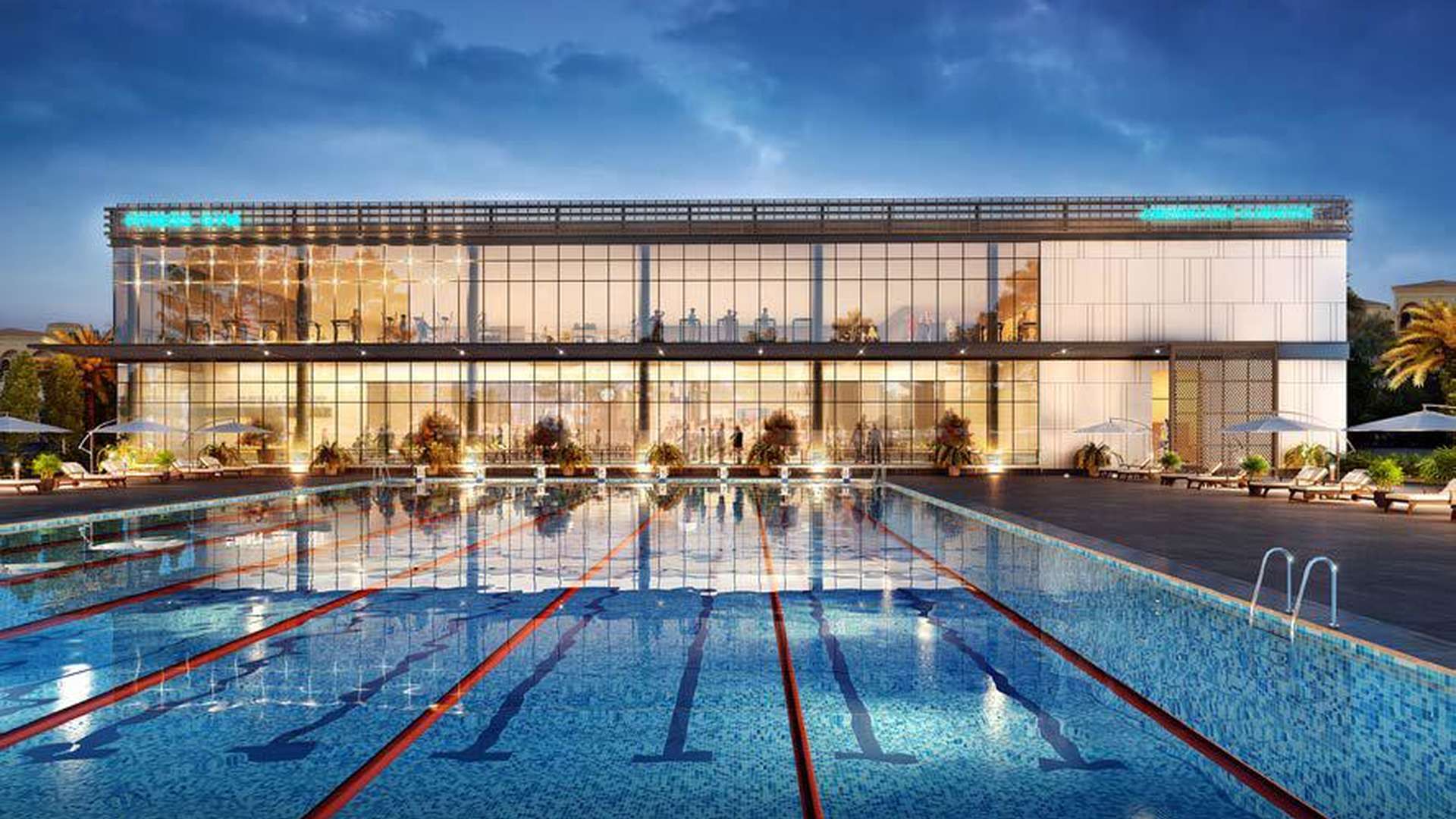 Outdoor pool and modern clubhouse at Jumeirah Park Homes villa community in Dubai