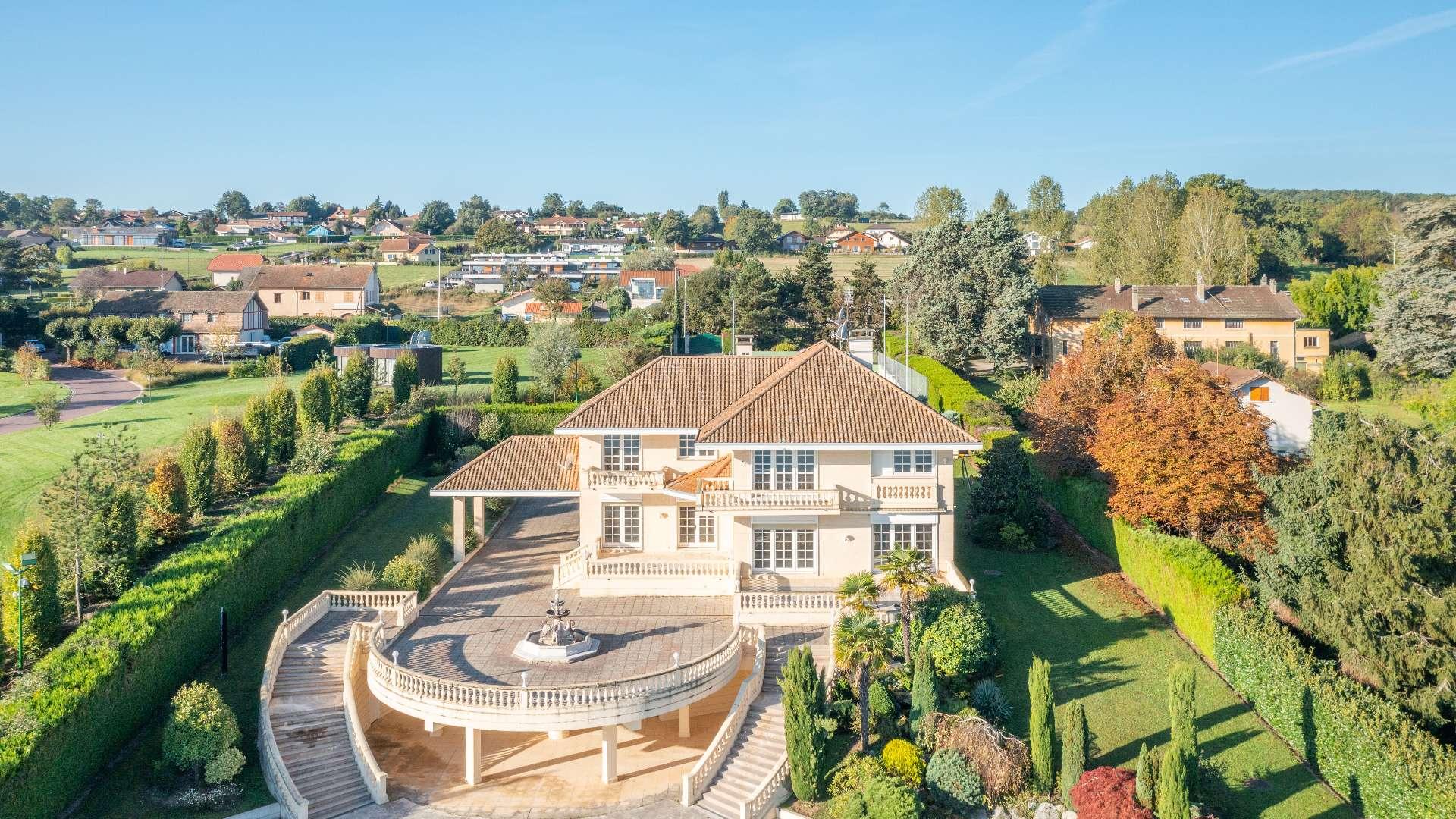 Aerial view of luxury villa on Lake Geneva, Excenevex, with stunning mountain backdrop
