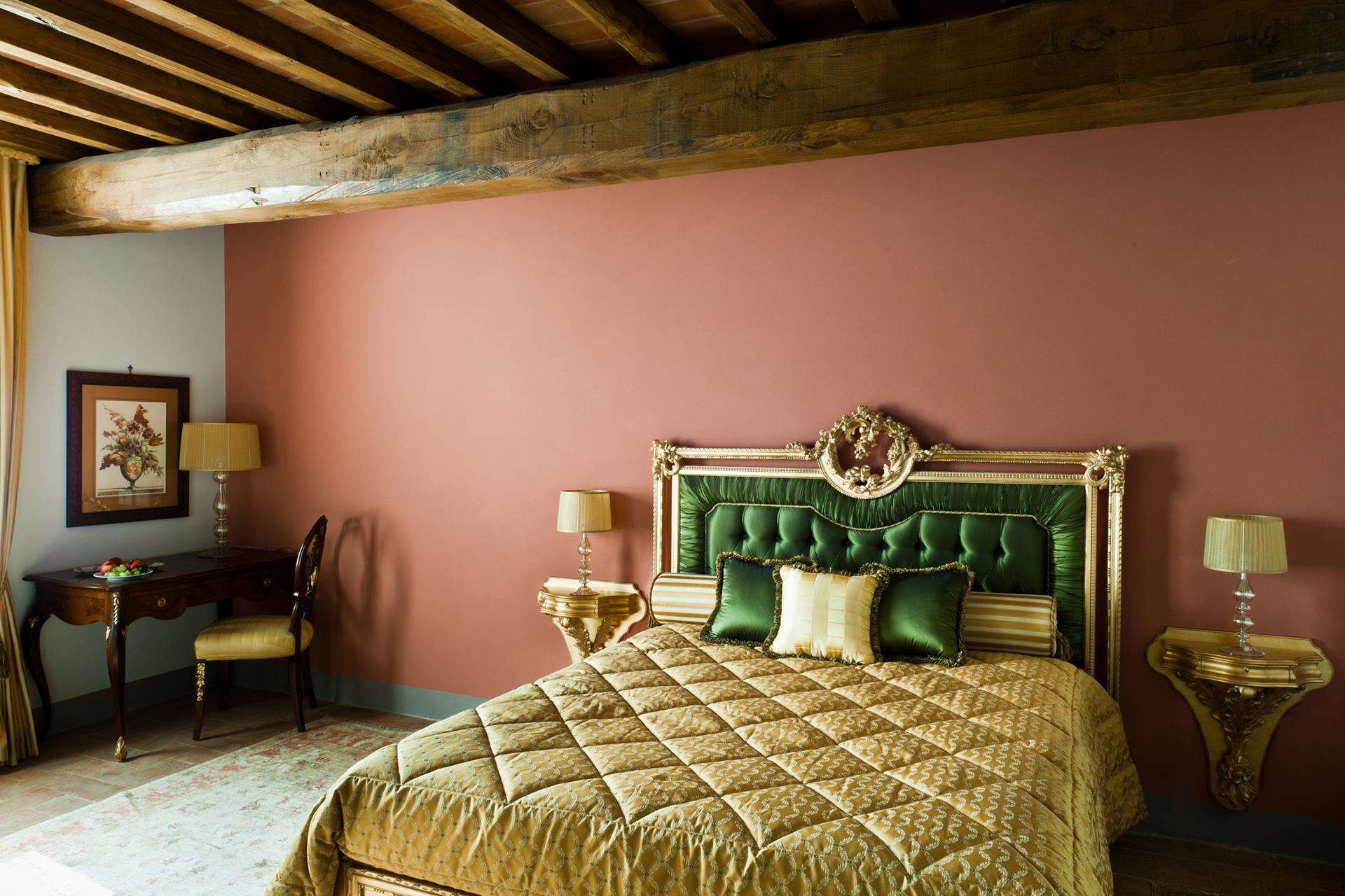 Luxurious Siena villa bedroom with rustic beams and elegant decor in boutique hotel style