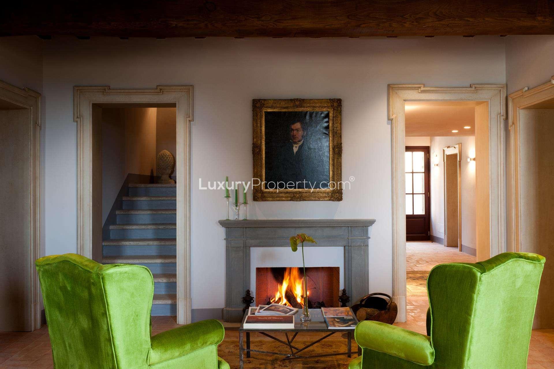 Luxurious bedroom in boutique hotel villa, Siena, featuring elegant decor and cozy ambiance