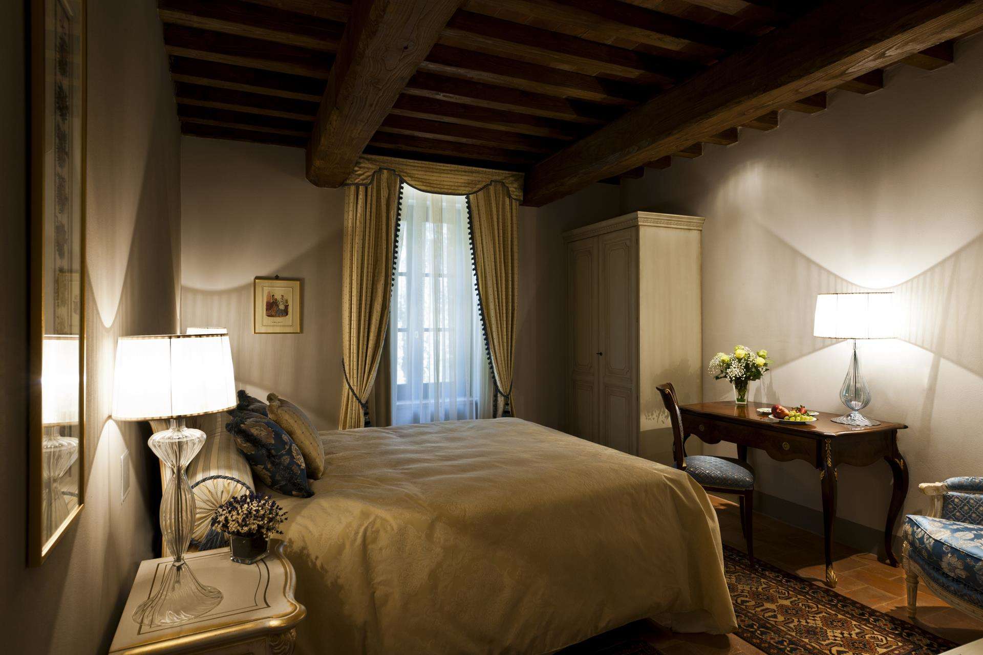 Luxurious bedroom in boutique hotel villa, elegant decor, Siena Luxury Retreat