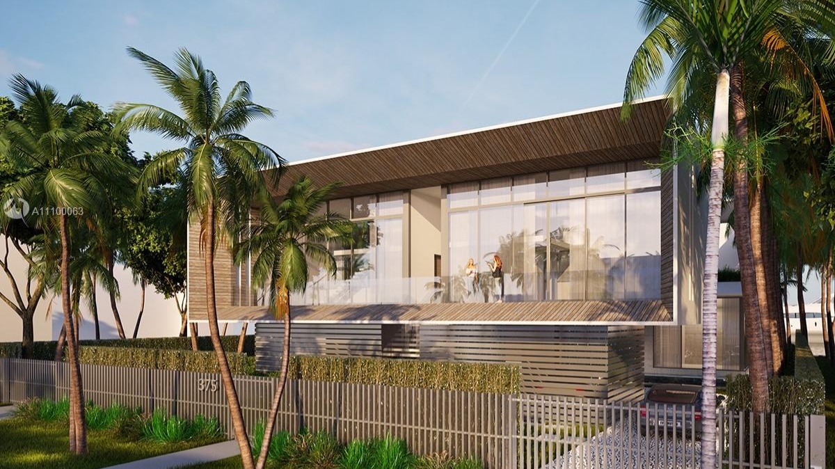 Luxury waterfront villa with pool and palm trees at 375 N Hibiscus Dr, Miami