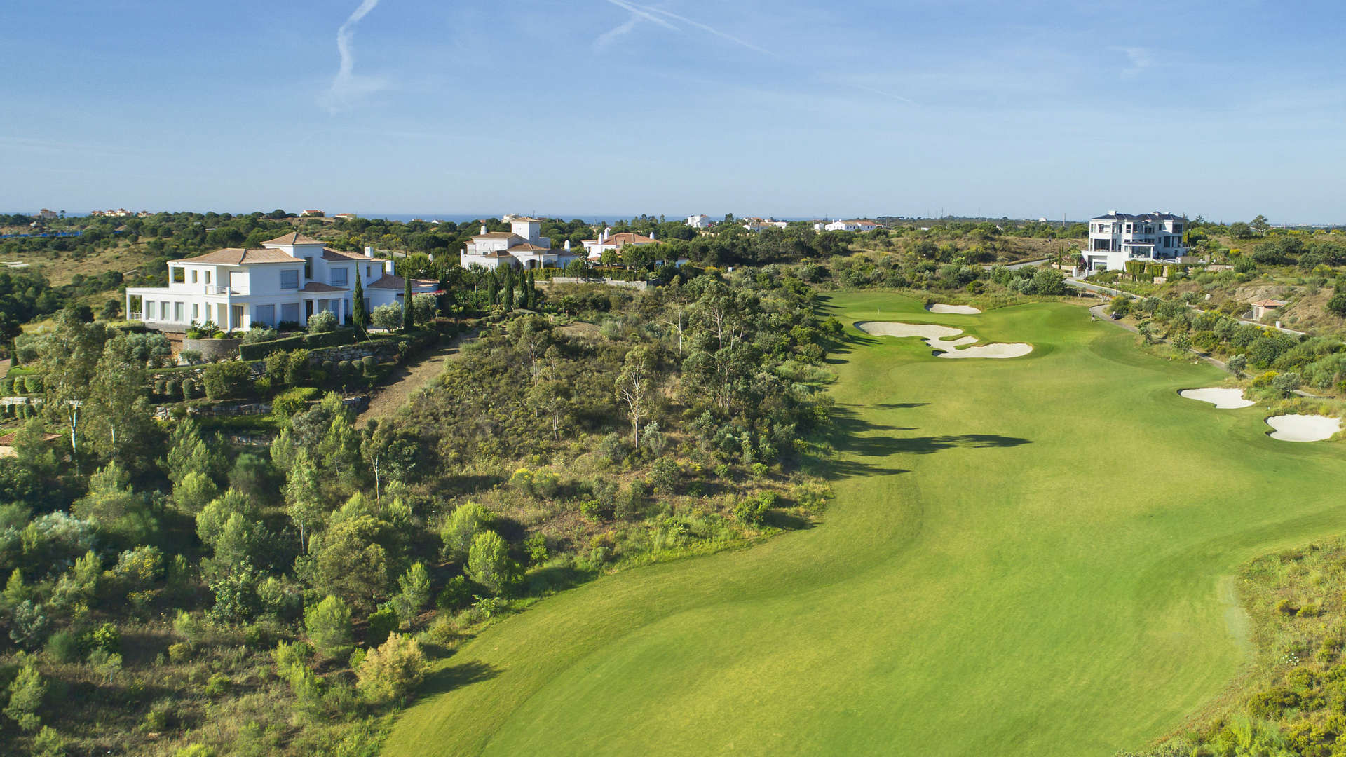 Monte Rei Algarve villa with lush greenery, scenic views, and luxurious residential architecture