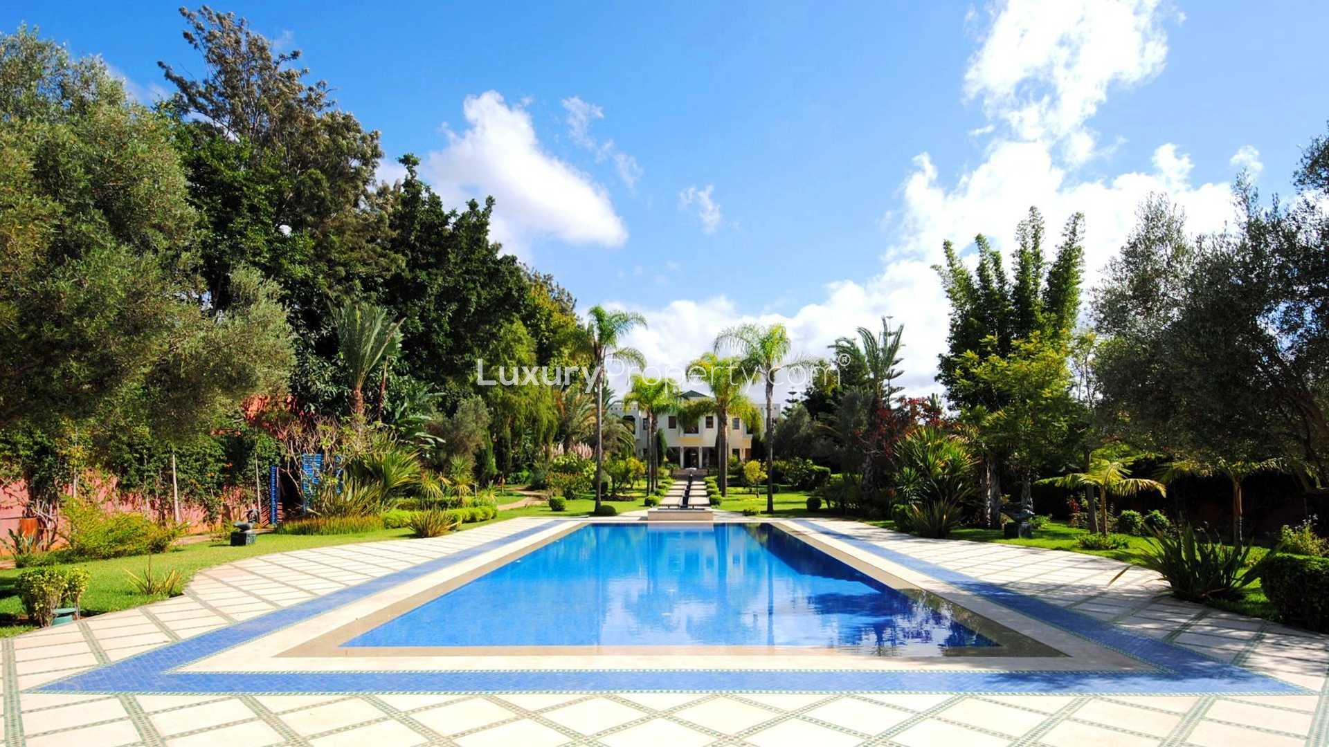 Luxurious Moroccan villa with pool and lush garden for sale in Rabat.