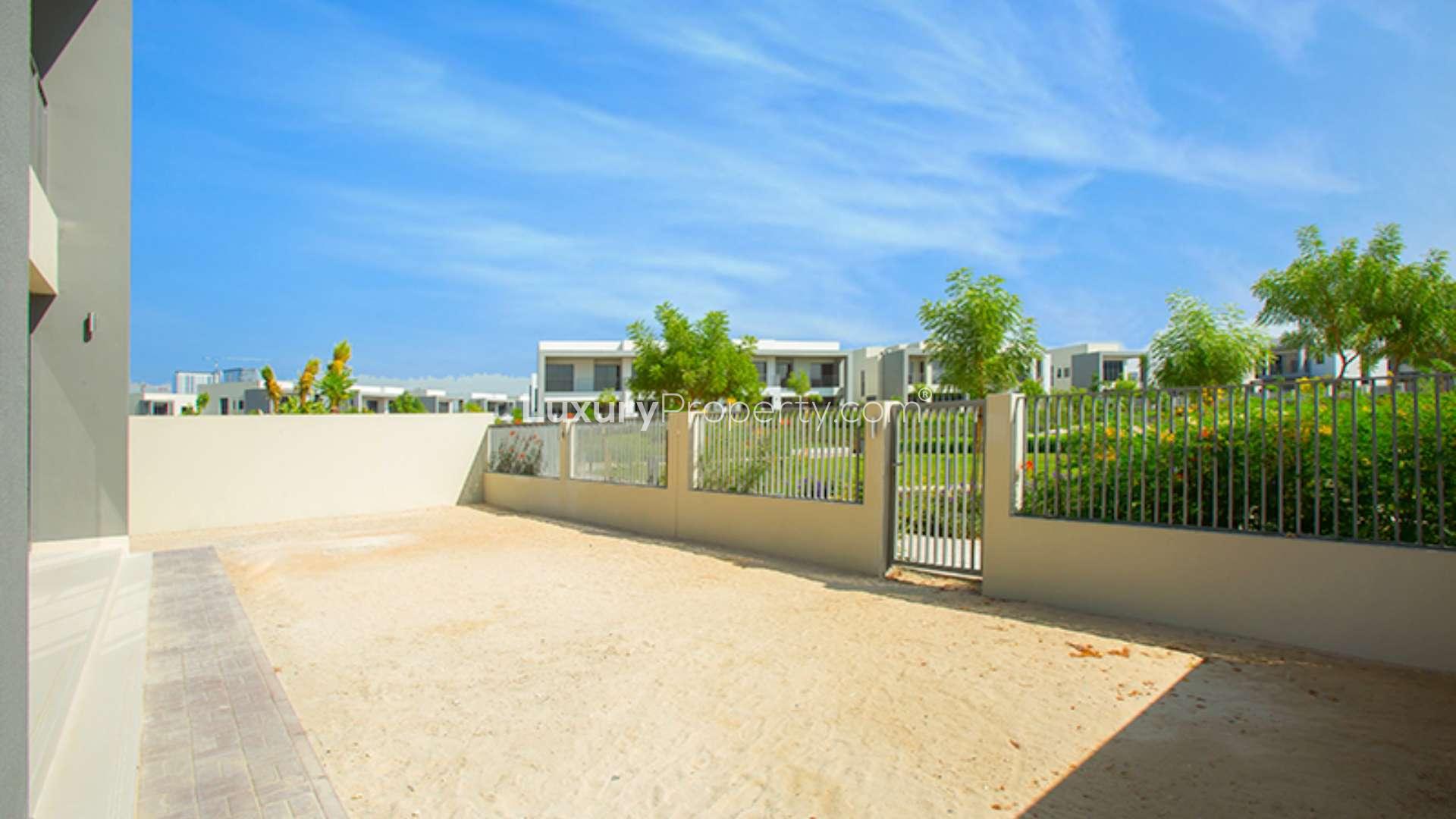 Modern 4-bedroom villa exterior in Sidra Villas, Dubai Hills Estate, lush garden view