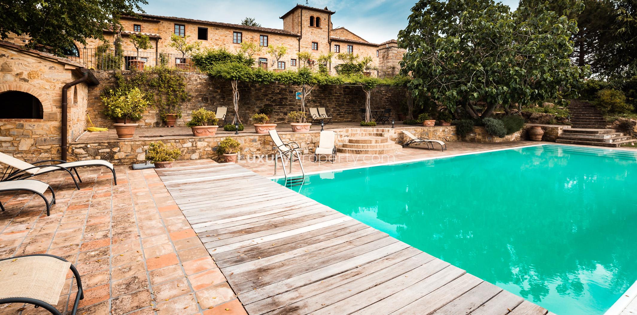 Stainless steel wine fermentation tanks at Tuscan villa estate in Florence, Tenuta La Favola