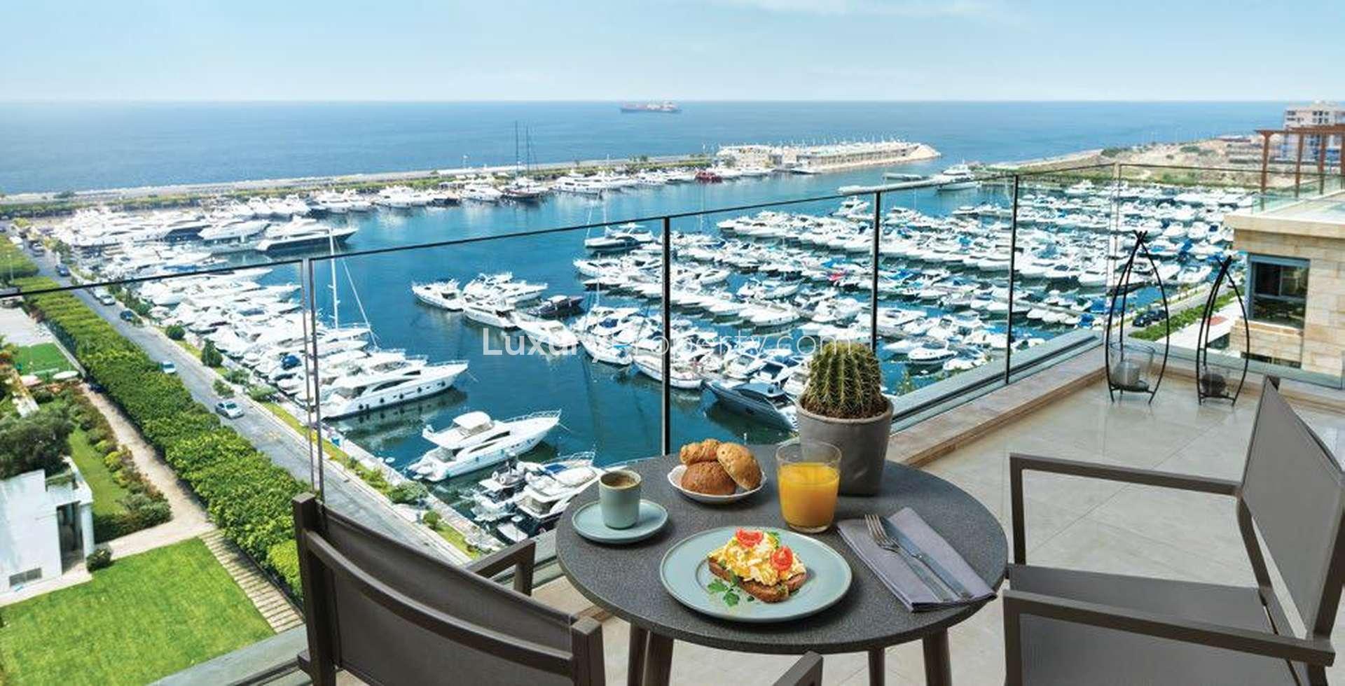 N/A,"Tilal Al Ghaf villa balcony view over marina with breakfast setting, studio for sale.",Studio villa interior at Tilal Al Ghaf Residences, featuring modern design and cozy layout