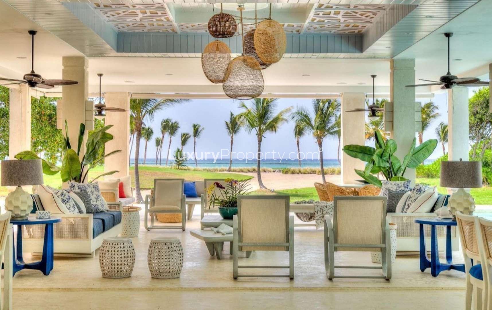 Open-air living area in Villa Arrecife, Punta Cana with tropical decor and ocean view