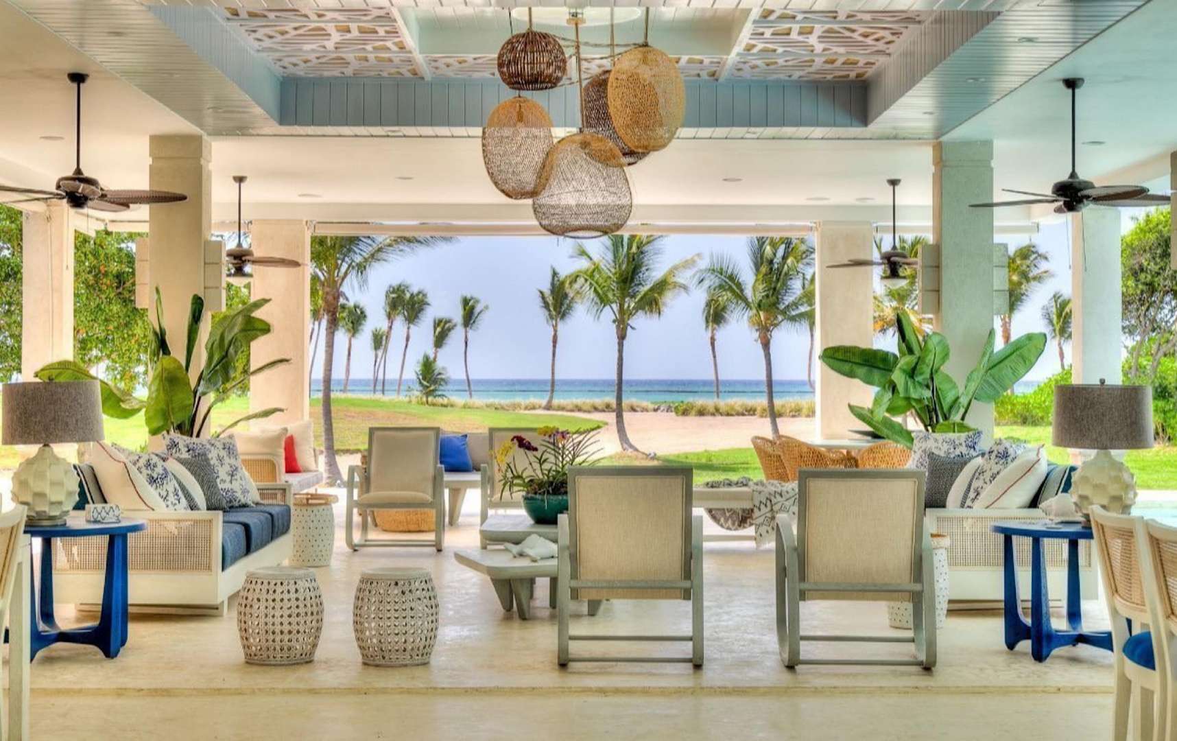 Open-air living area in Villa Arrecife, Punta Cana with tropical decor and ocean view