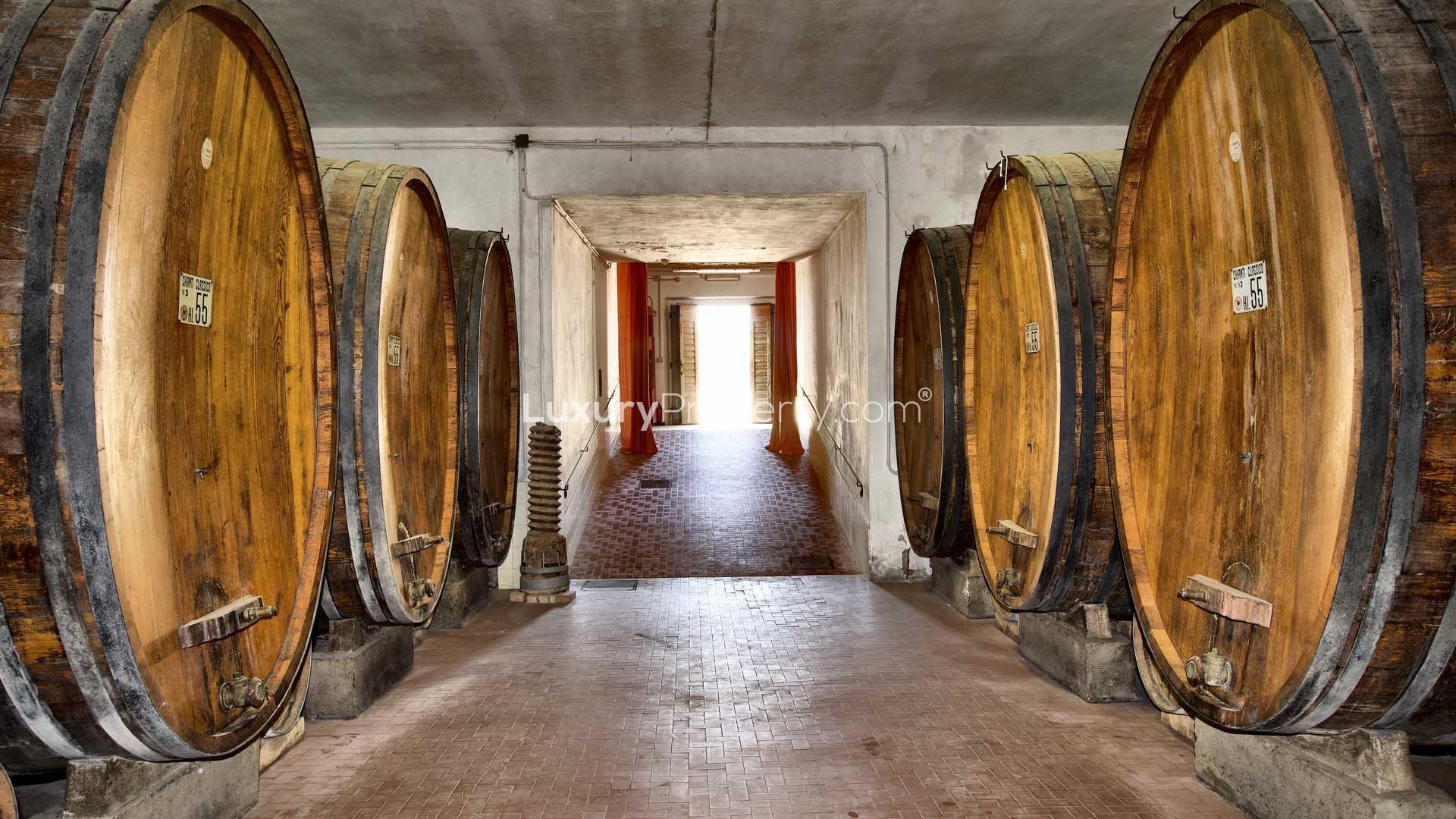Rustic bedroom with wooden beams in 16th-century Chianti villa, Tuscany, for sale