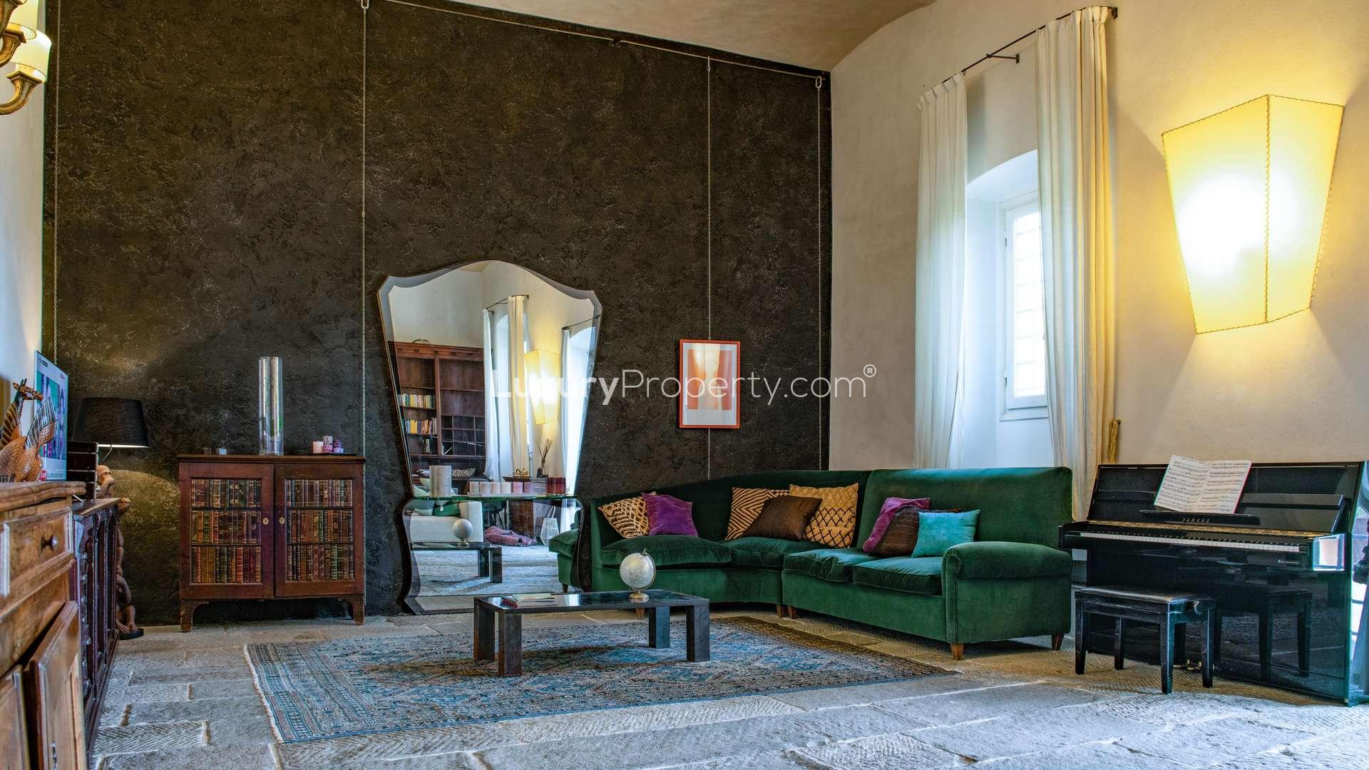 Luxurious living room in 16th-century Tuscan villa, featuring elegant furnishings and natural light