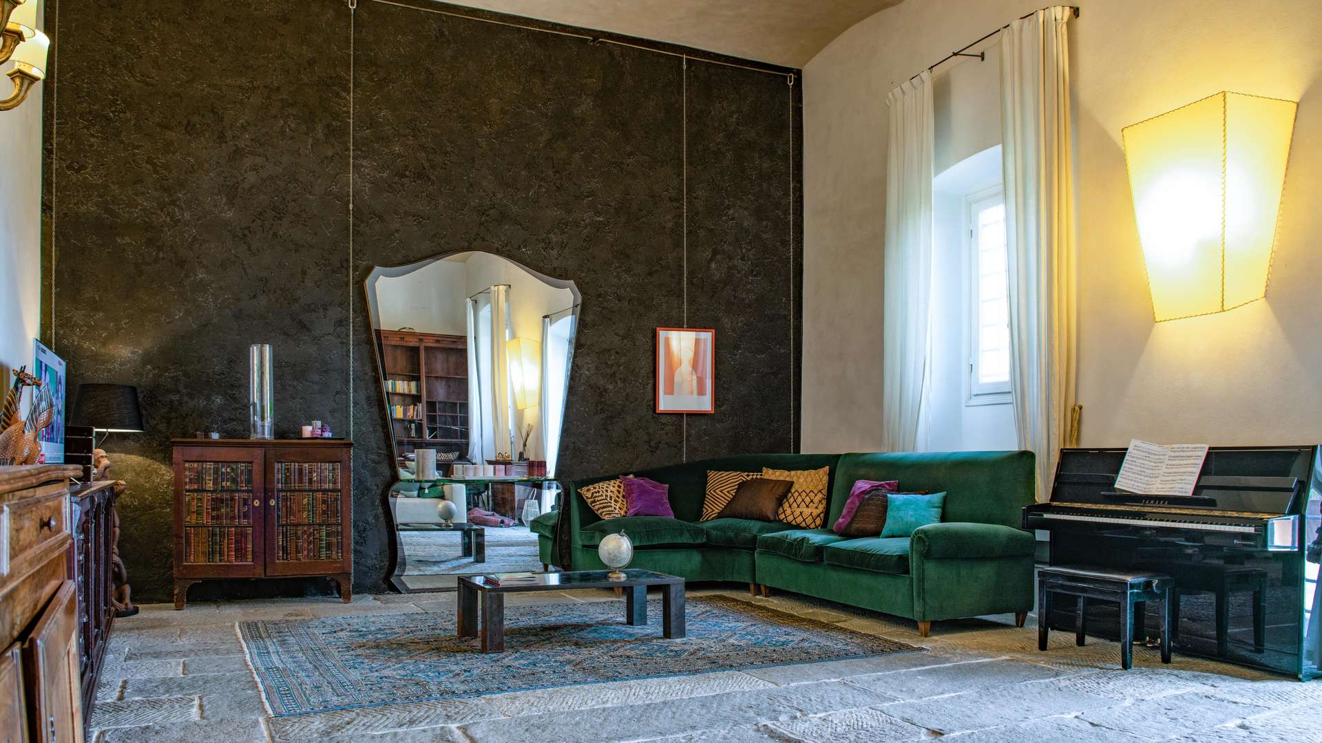Luxurious living room in 16th-century Tuscan villa, featuring elegant furnishings and natural light
