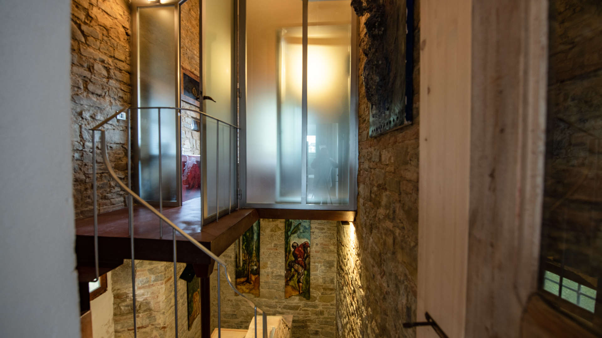 Luxurious living room in 16th-century Tuscan villa, featuring elegant decor and piano