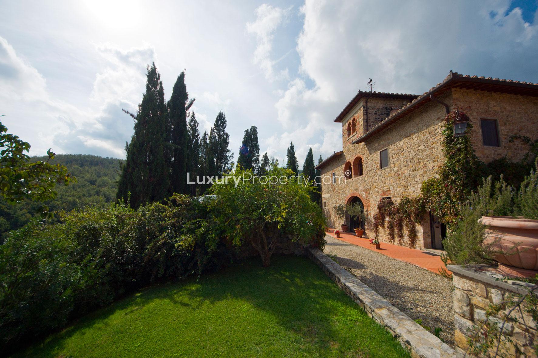 Warm-toned bedroom in Villa Panorama, Florence with elegant decor and natural light