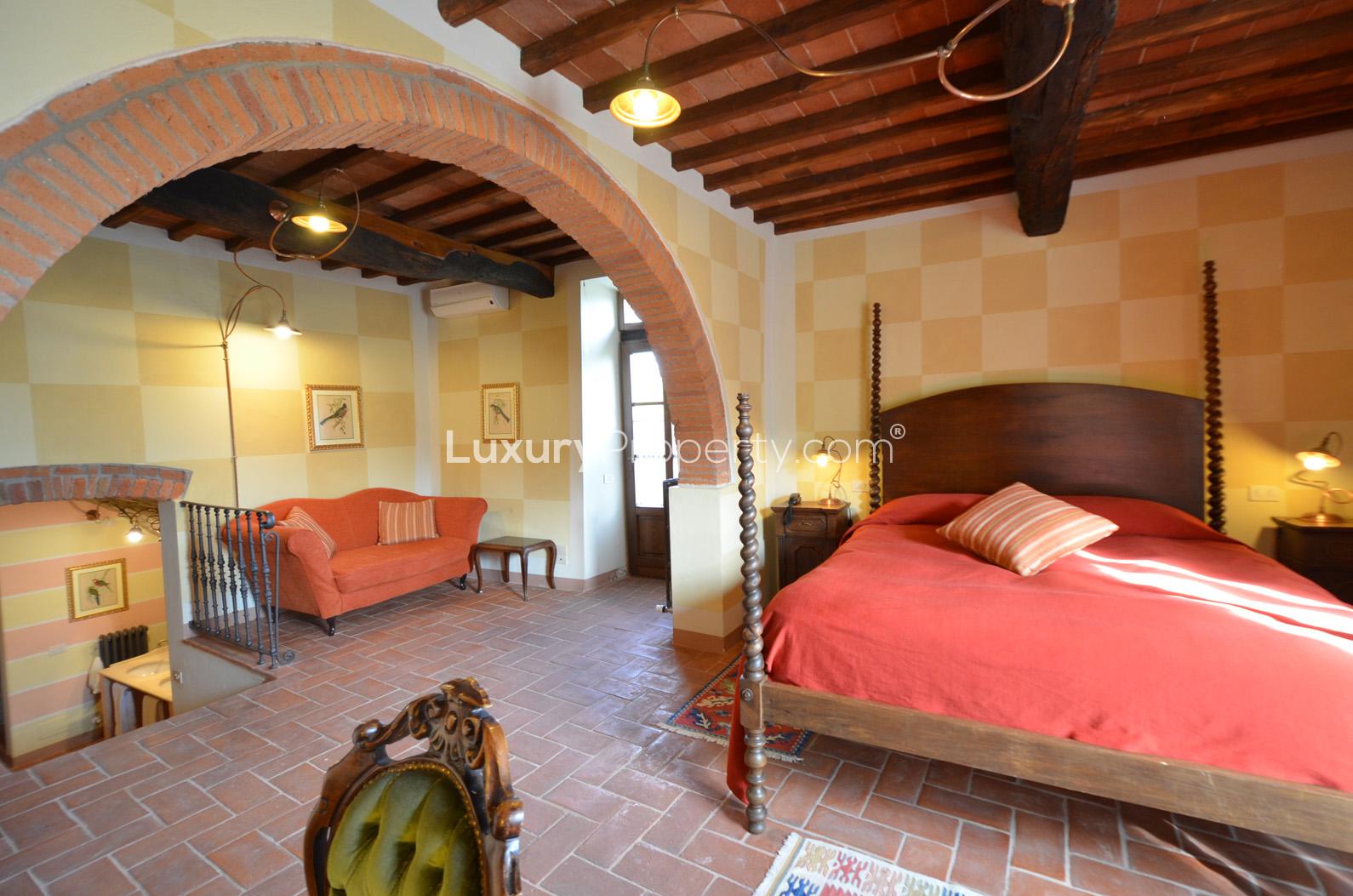 Luxurious stone-walled bathroom with jacuzzi in Villa Tramonto, Arezzo countryside