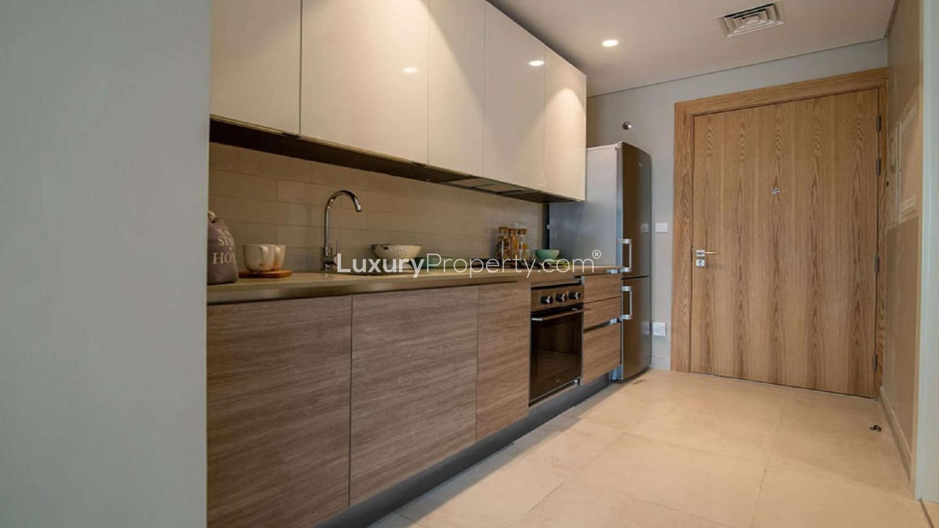 Fully furnished studio apartment interior at Olivara Residences, Dubai Studio City for rent