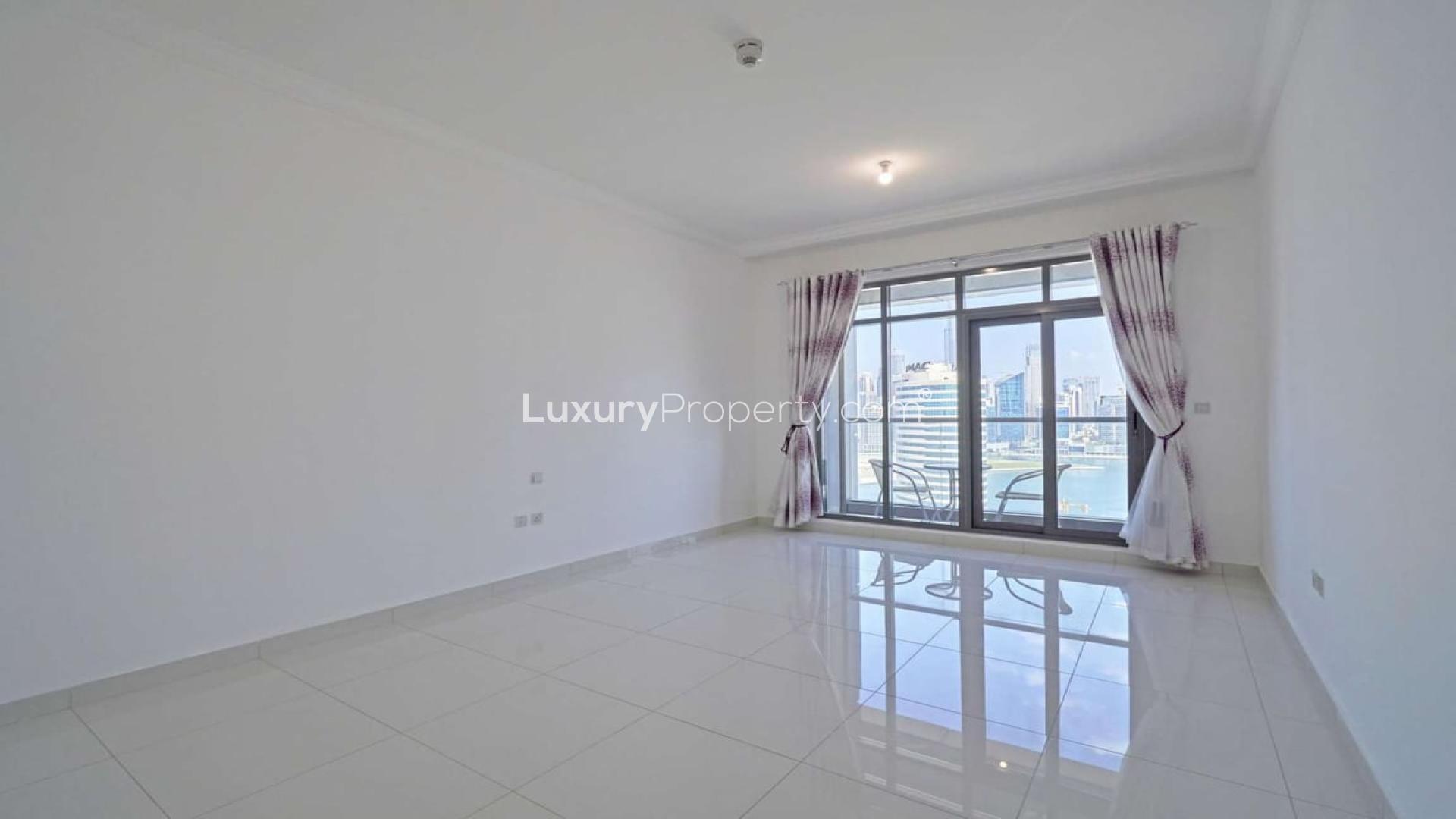Studio apartment kitchen with sleek design and city view in Executive Bay, Business Bay