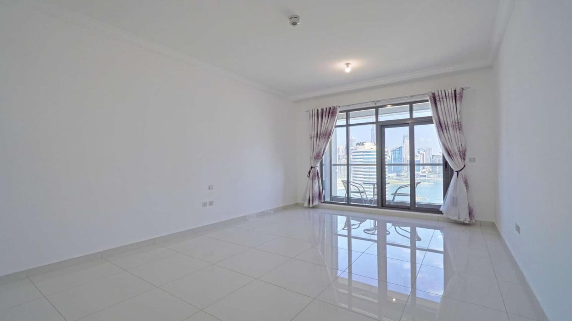 Studio apartment kitchen with sleek design and city view in Executive Bay, Business Bay