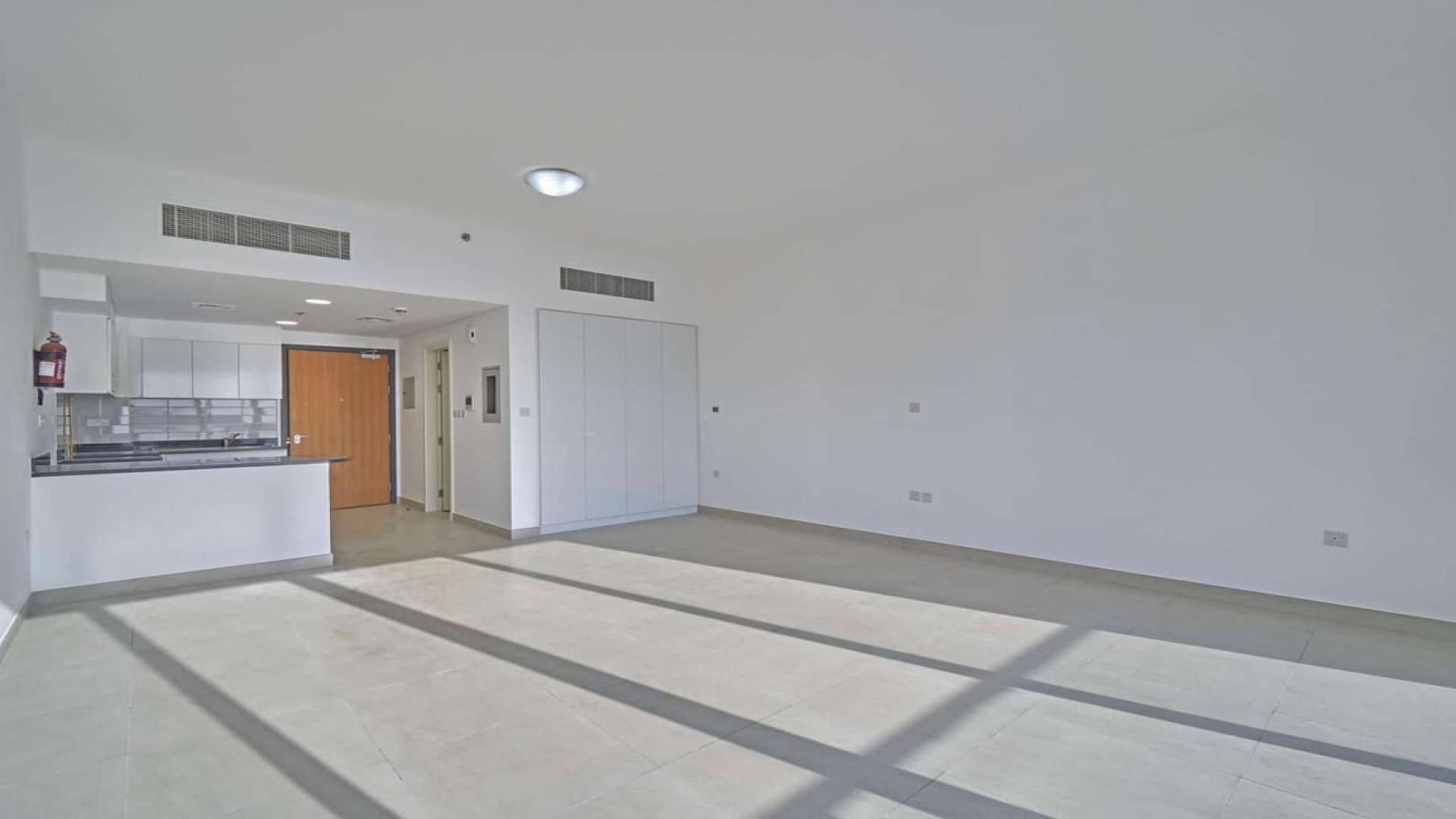 Modern apartment building facade in Al Barsha, near Mall of the Emirates, for rent