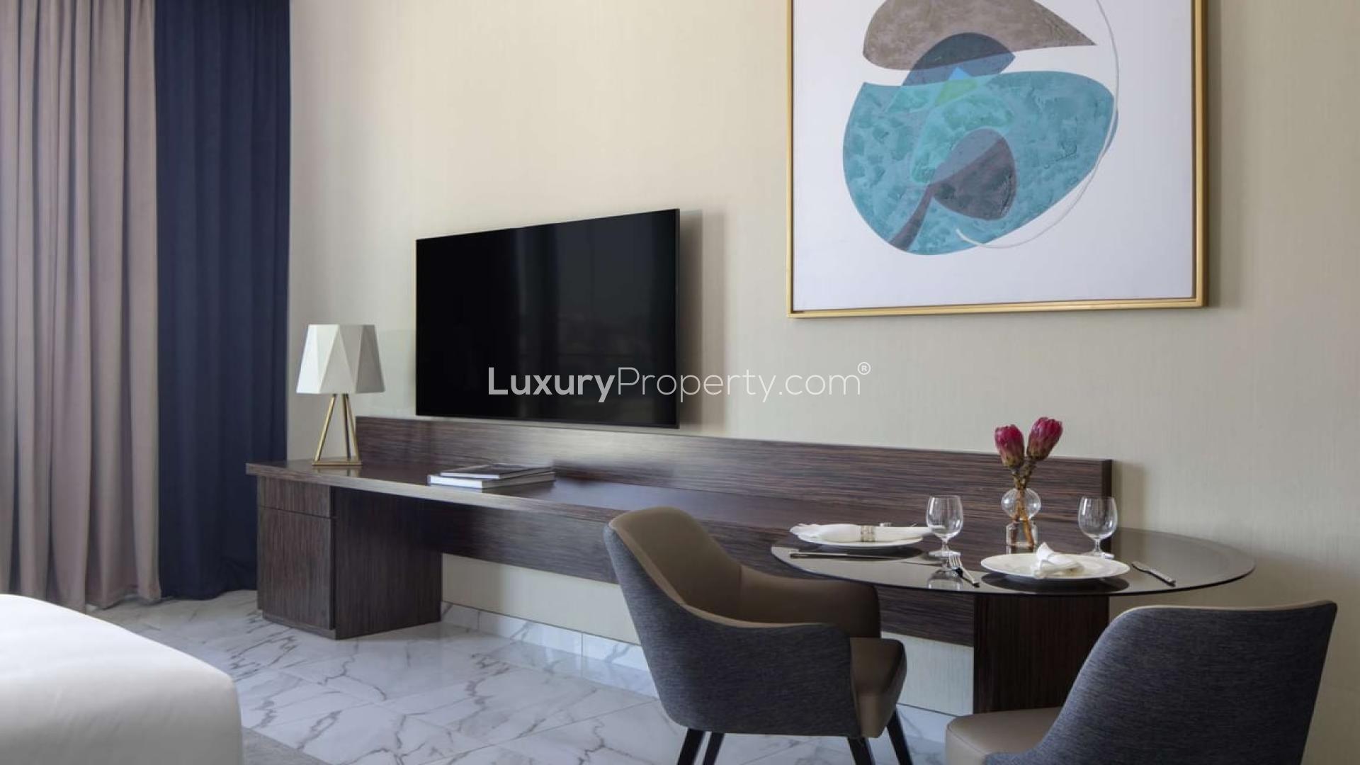 Modern studio apartment interior at Avani Palm View, Dubai Media City, with dining area