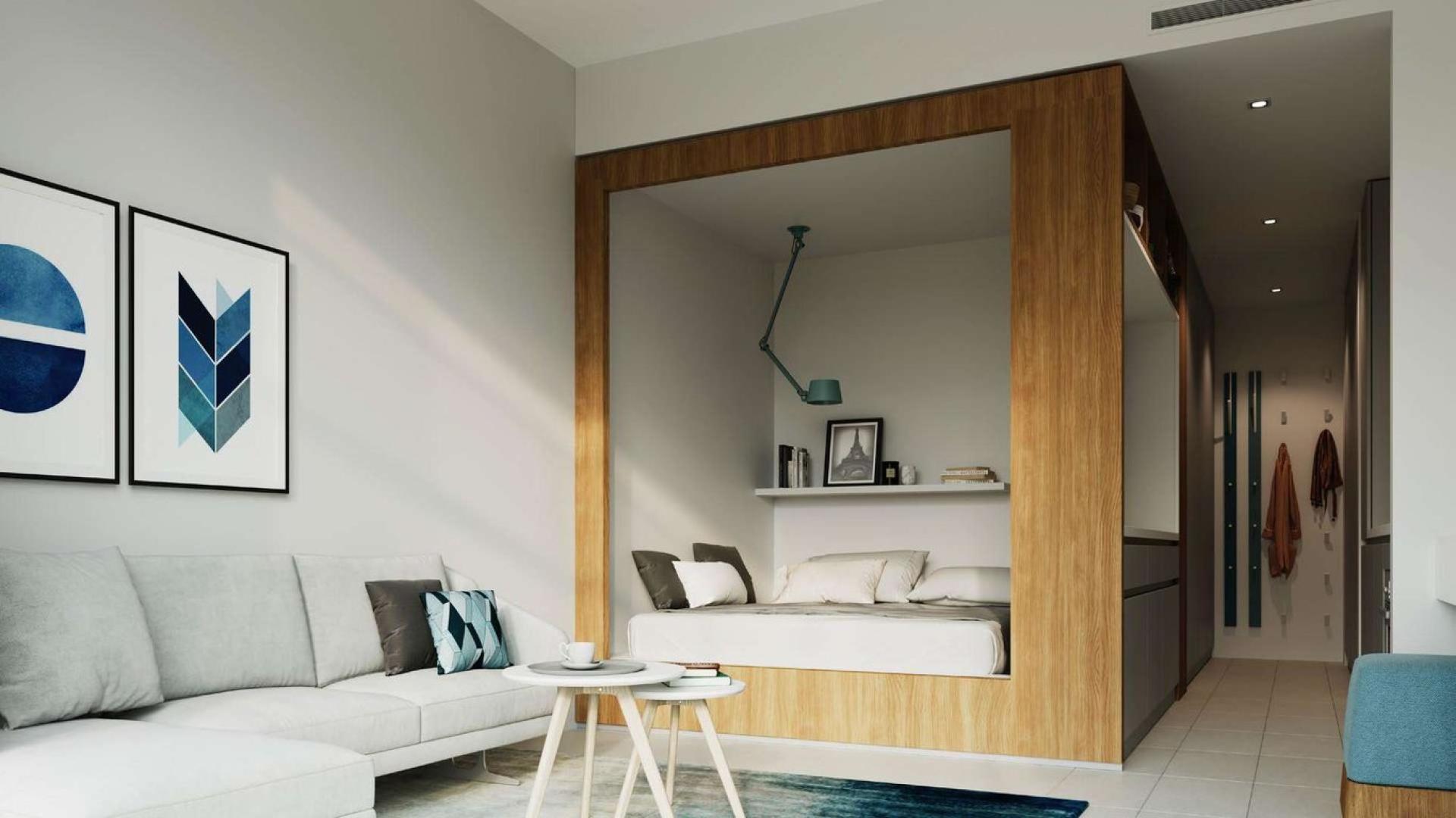 Modern glass entrance of beachside studio apartment at Tilal Al Ghaf, Dubai for sale