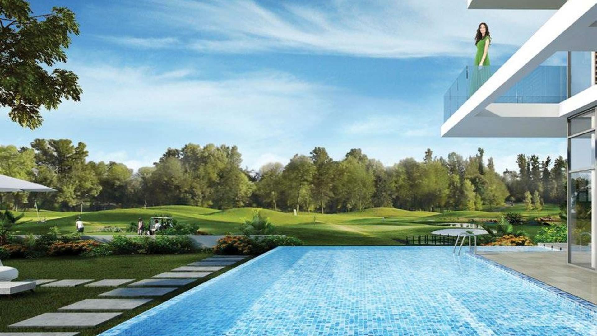 "Modern studio apartment building in Viridis Residence, Akoya Oxygen, Dubailand for sale.",Studio apartment balcony overlooking pool and golf course in Akoya Oxygen, Dubailand