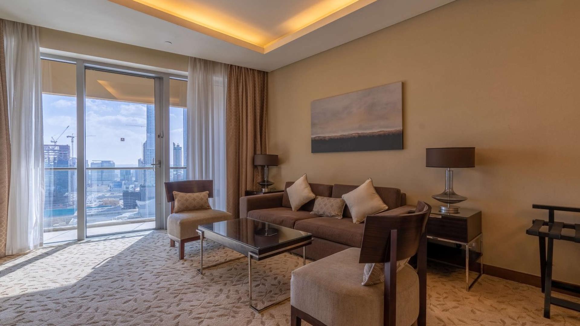 Modern living room with Burj Khalifa view, Downtown Dubai apartment, high floor elegance