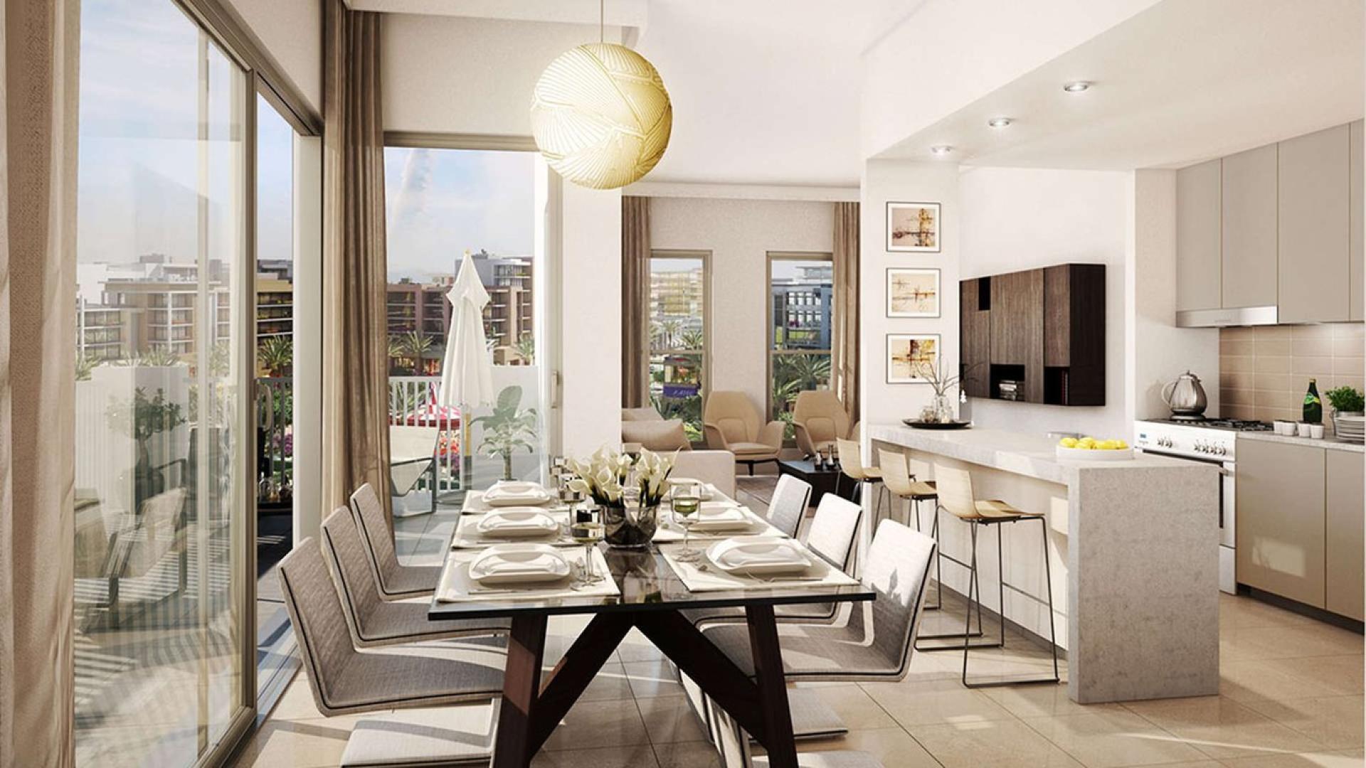 Luxury studio interior at Safi Apartments, Town Square Dubai, featuring modern kitchen and dining area